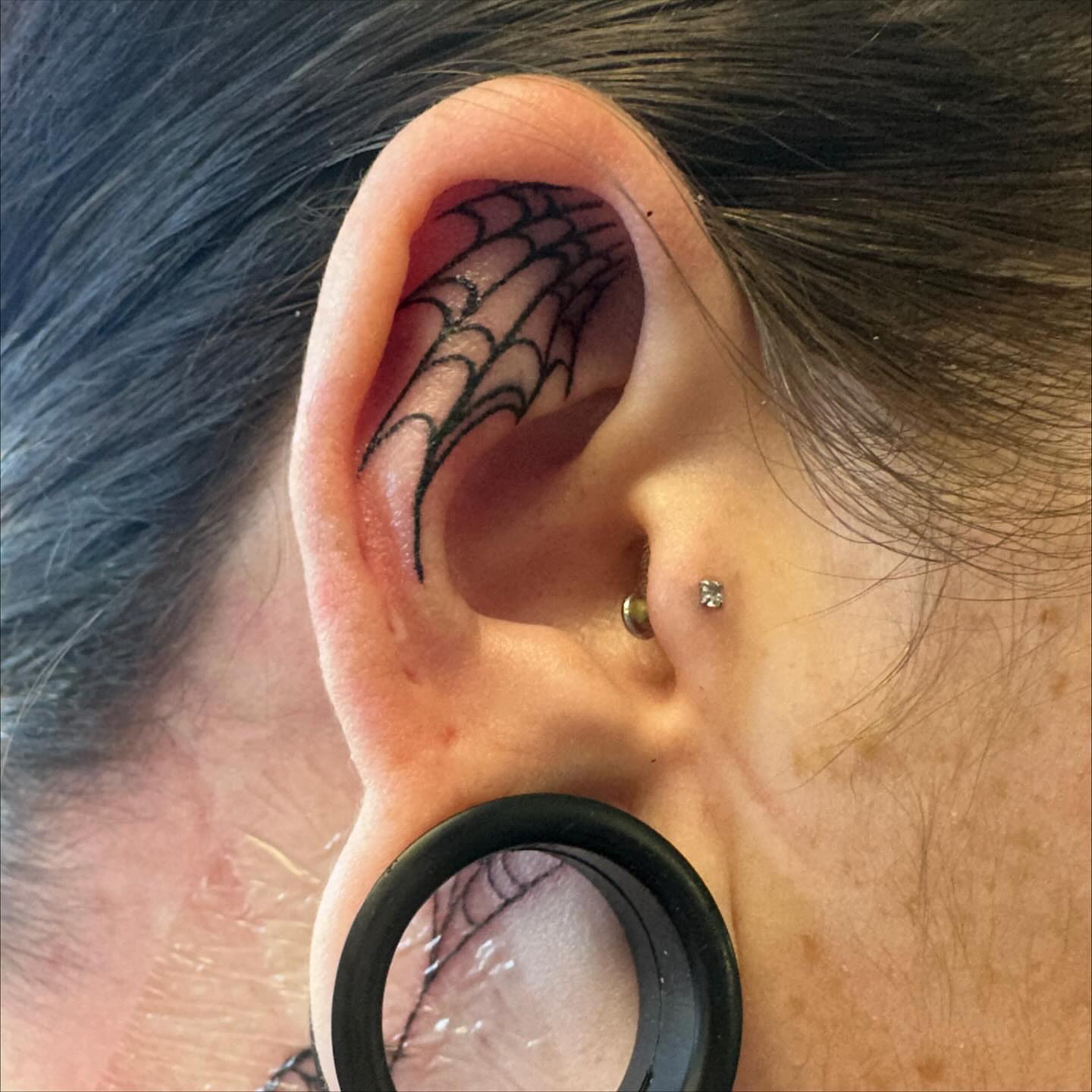 Spiderweb blackwork tattoo by Sarah Nash