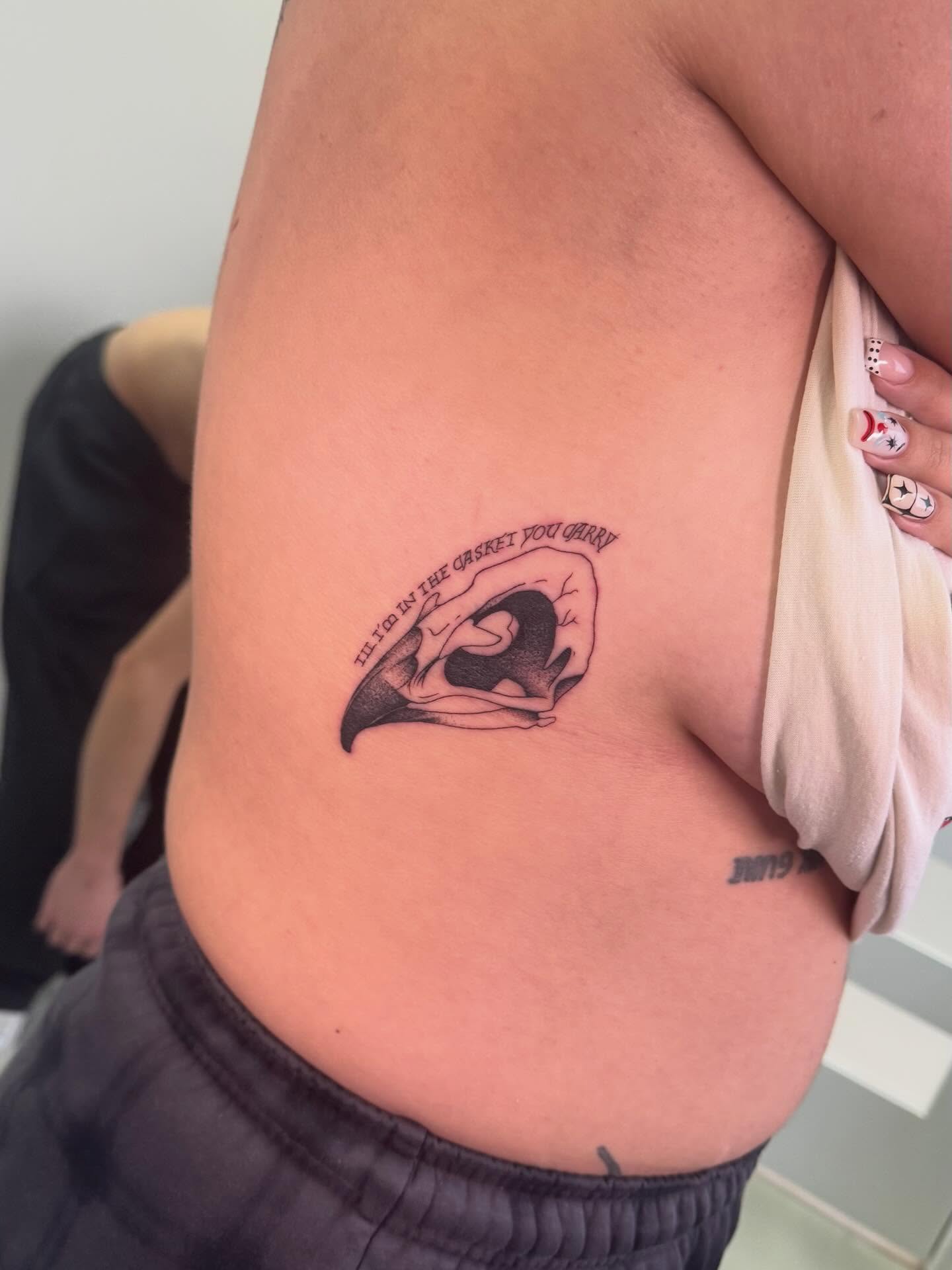 Woman in embrace black and grey tattoo on the ribs by haylie