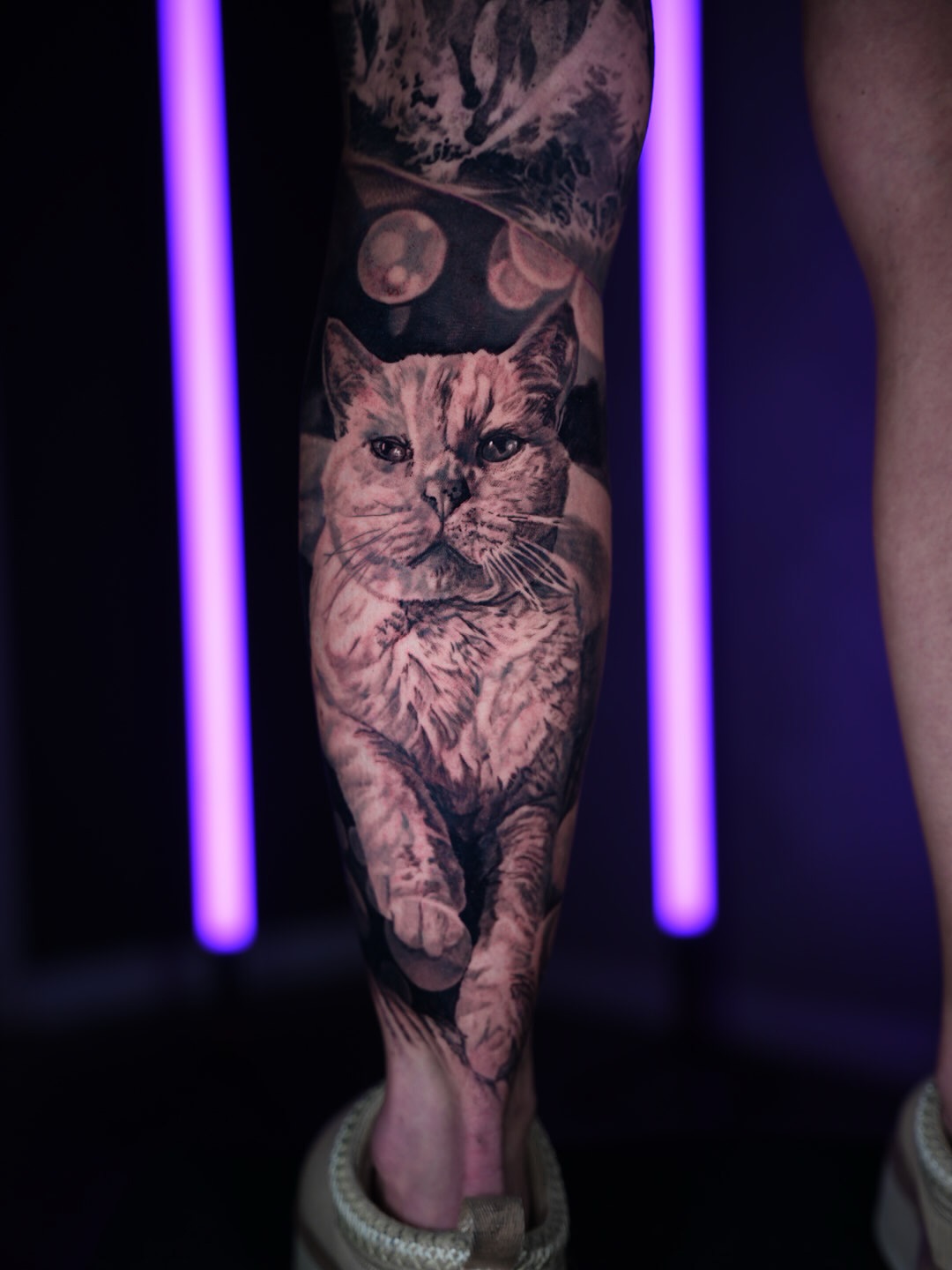 Cat realism tattoo on the calf by Bailey Lemus
