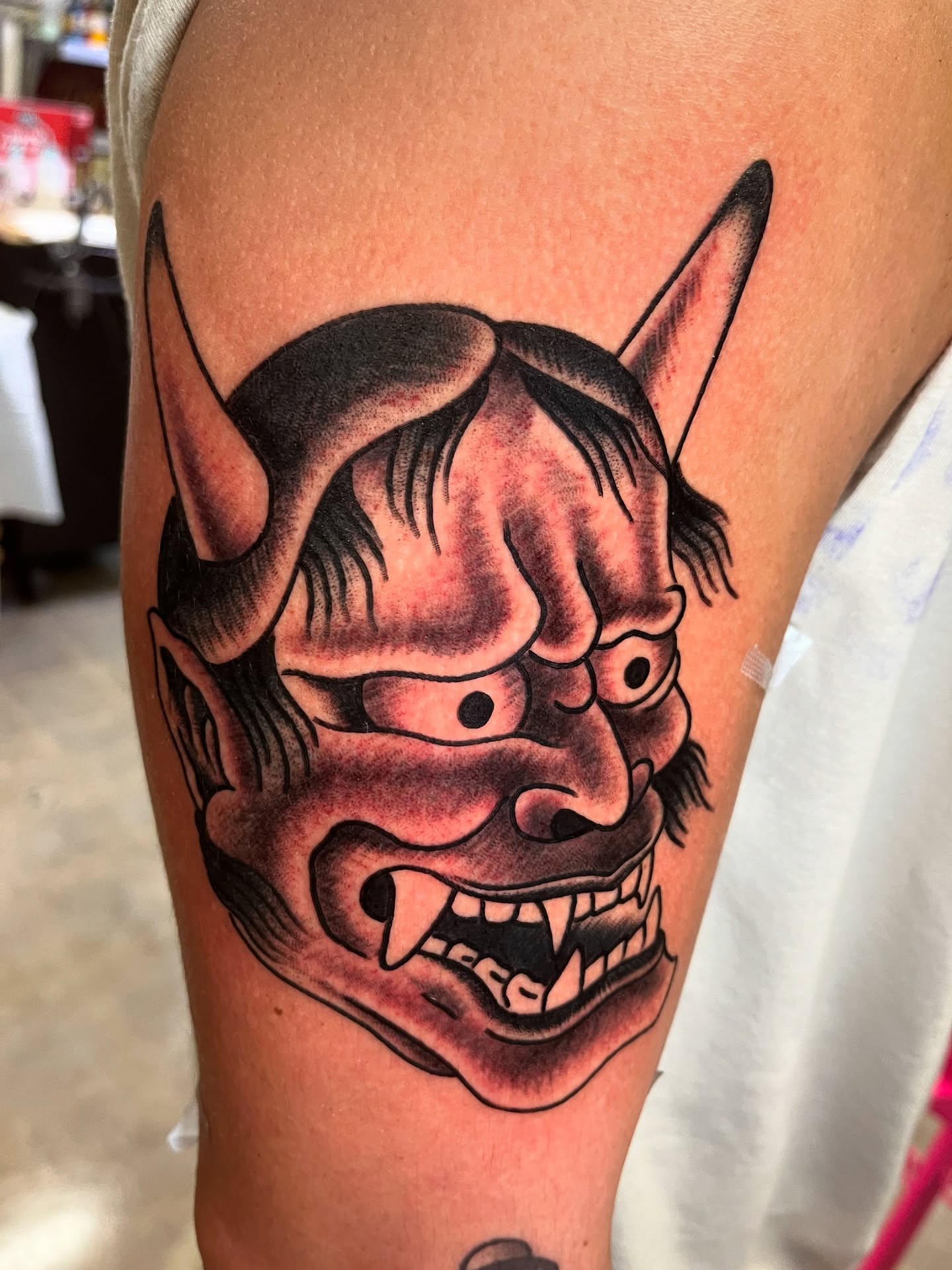 Demon mask japanese irezumi tattoo on the thigh by Tim Howell