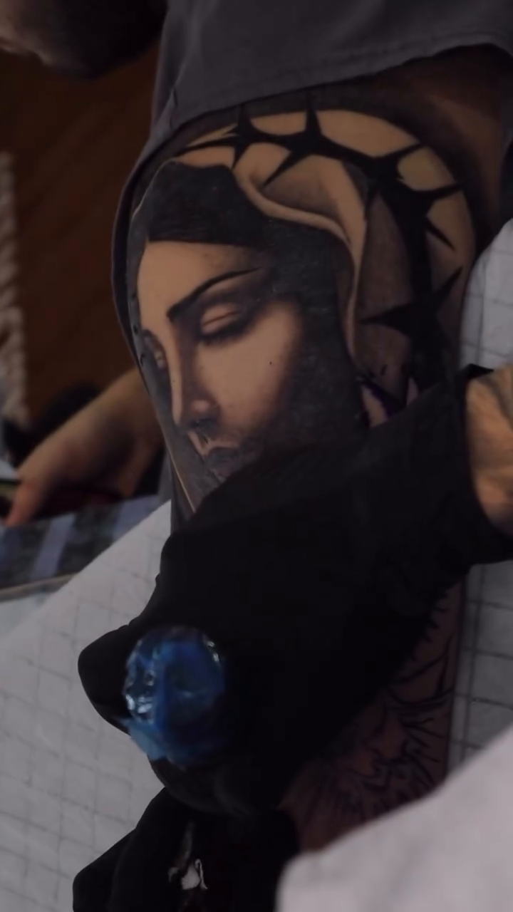 Virgin Mary and dove realism tattoo by caleb coley