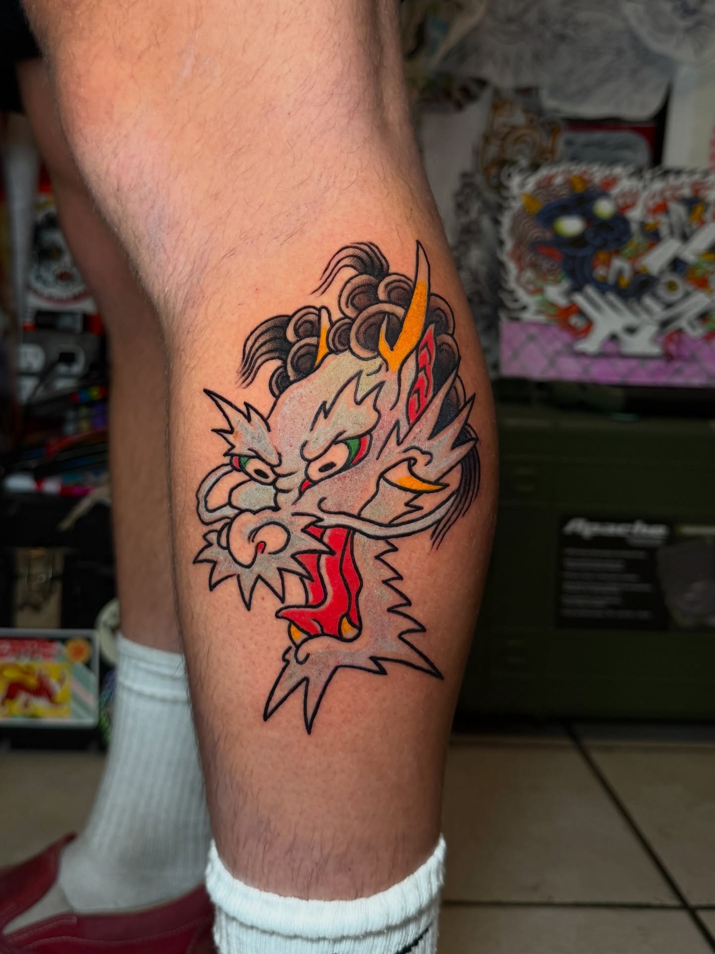 Dragon head American traditional tattoo on the thigh by Tattoo Artist Los Angeles