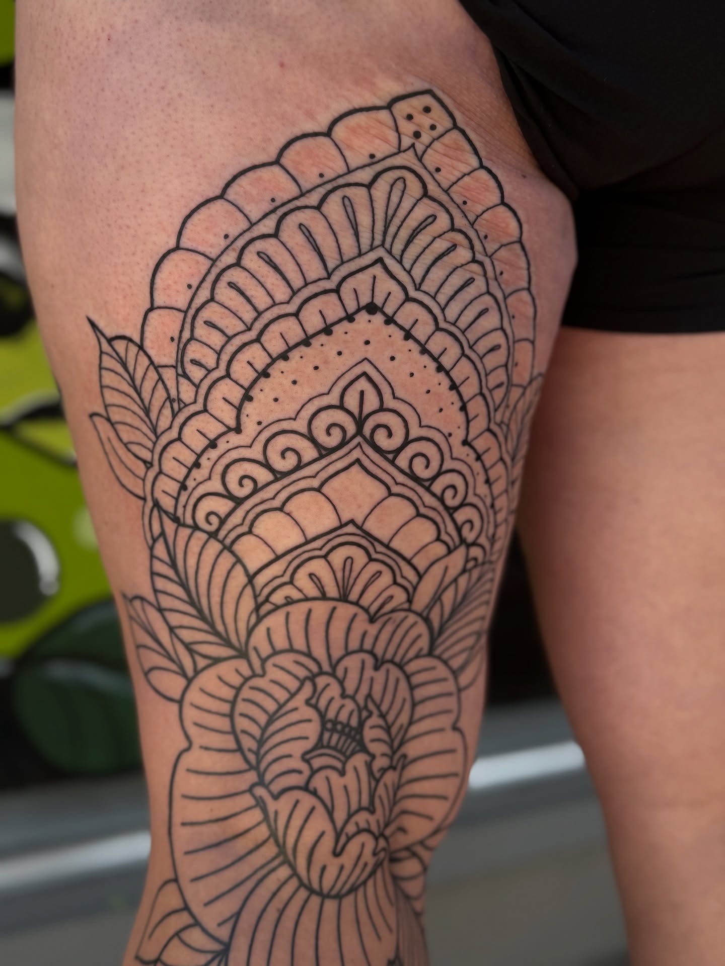 Floral mandala ornamental tattoo on the thigh by Loren Elbert