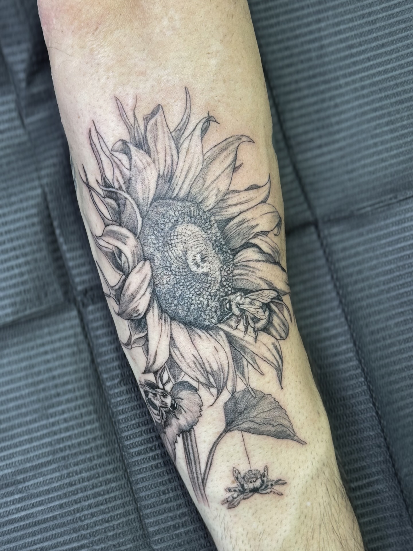 Sunflower realism tattoo on the forearm by Brows & Tattoos