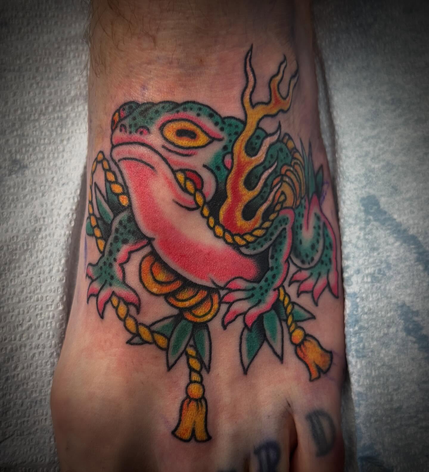 Frog American traditional tattoo on the foot by Austin Liebst, Wichita, Kansas