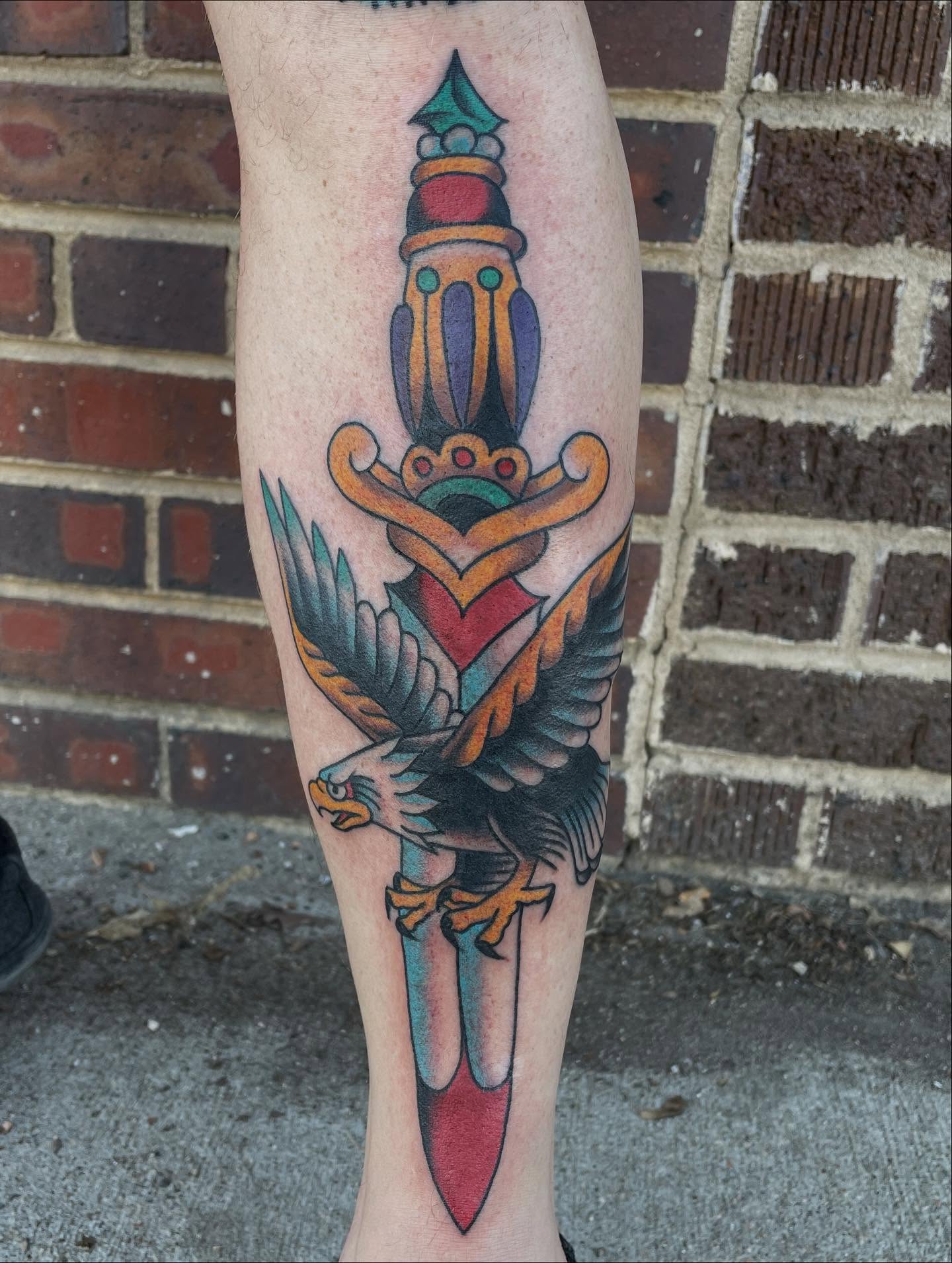 Eagle and dagger American traditional tattoo on the forearm by Haley McMahon