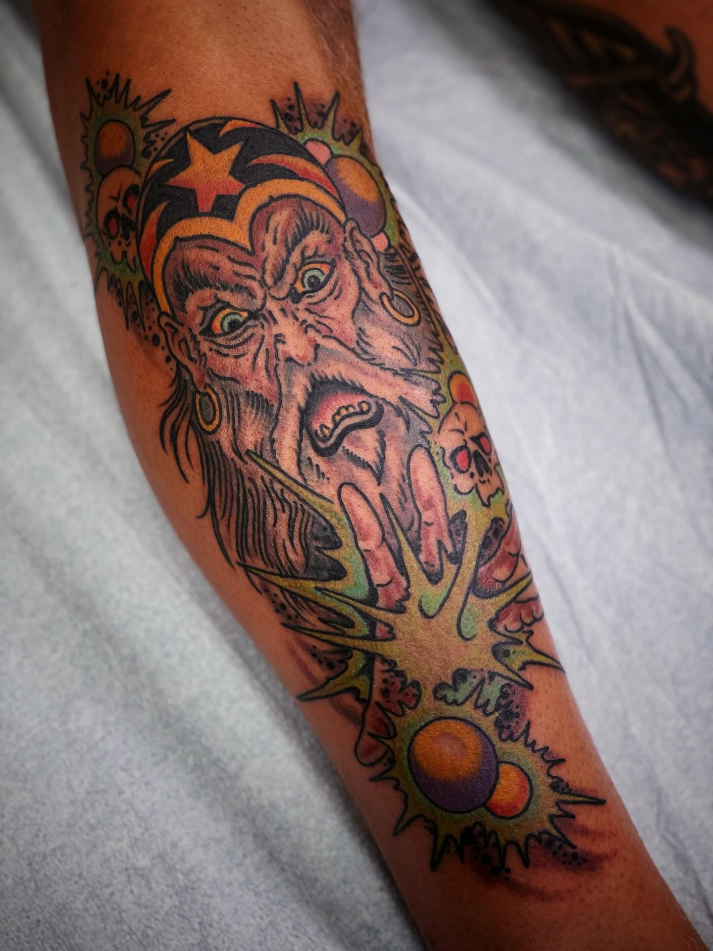 Bearded demon American traditional tattoo on the forearm by Zac Blevins