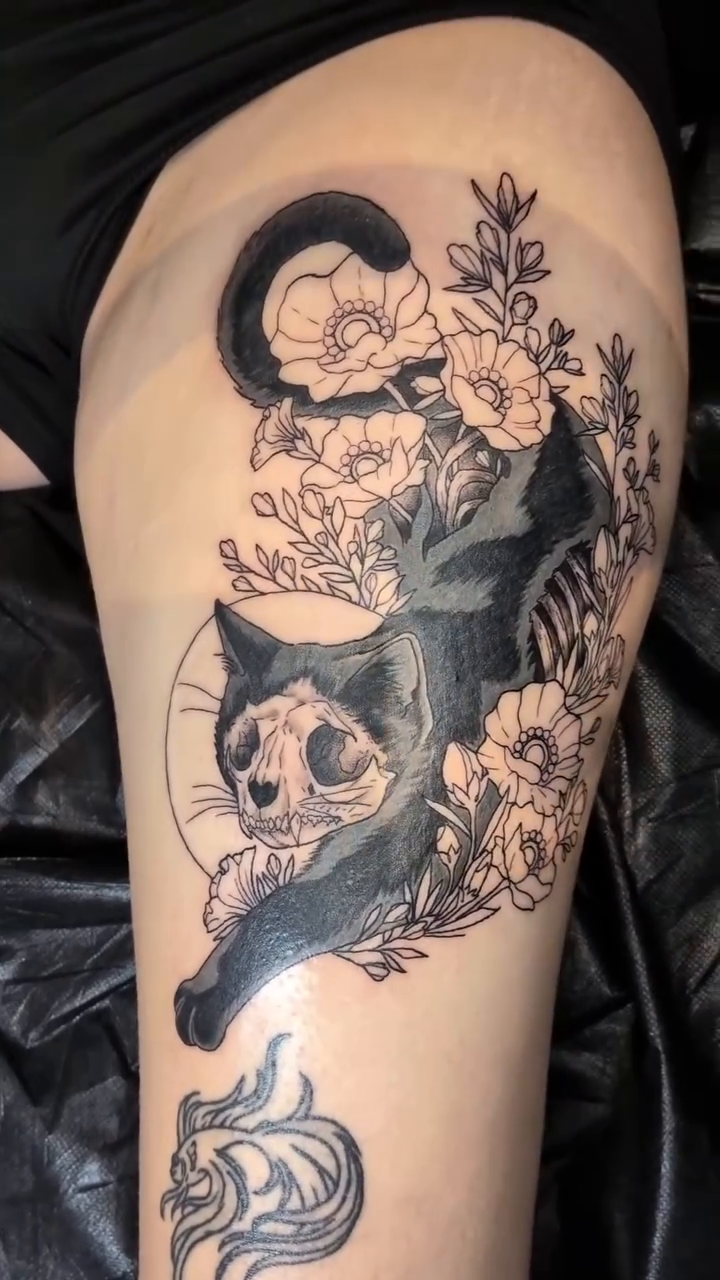 Black cat with skull and flowers fine line tattoo on the leg by Damon 🥀