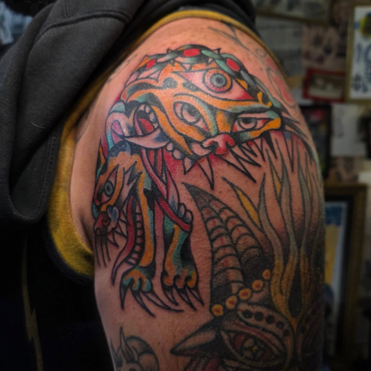 Lion American traditional tattoo on the shoulder by Mitch Braver