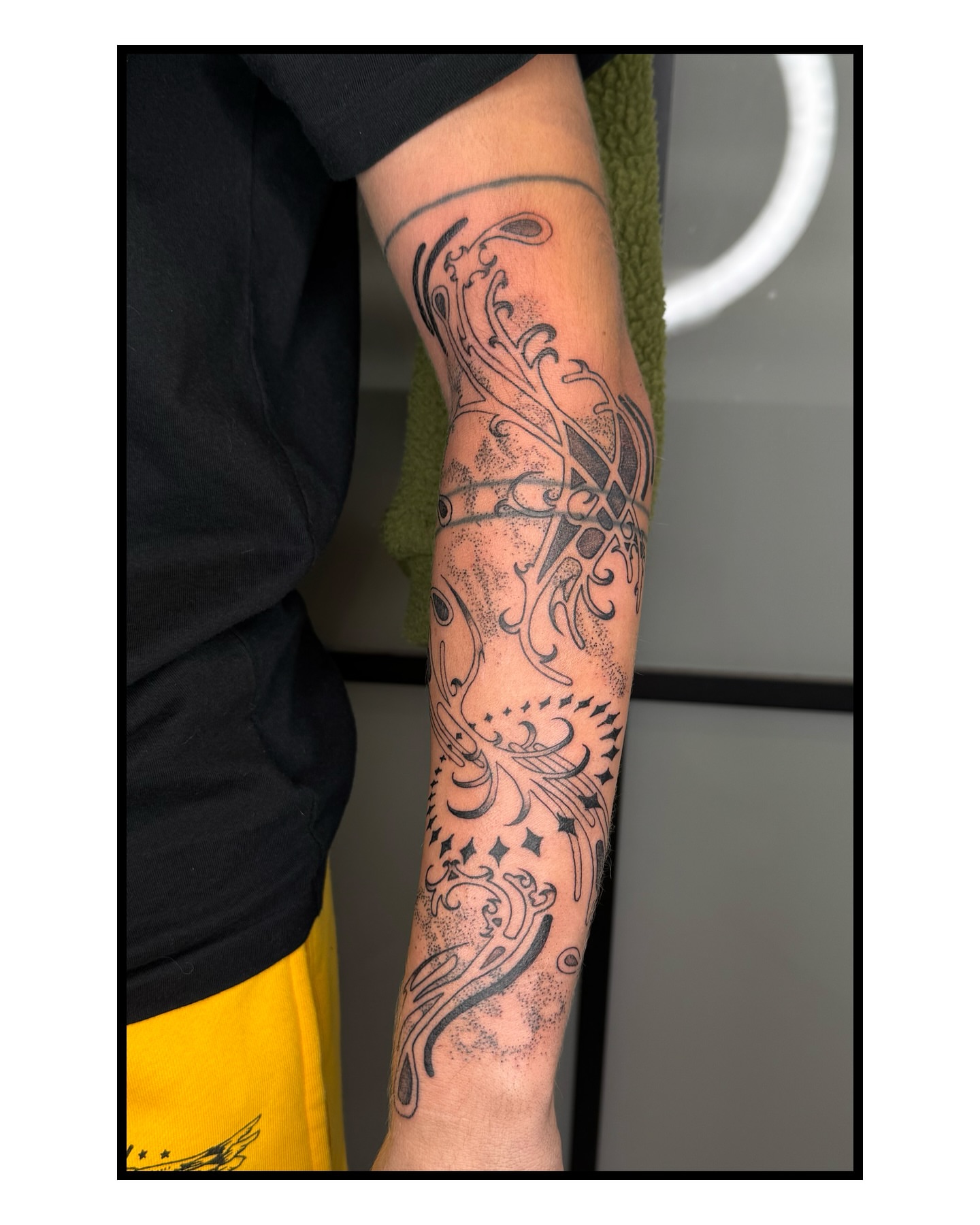 Abstract floral design ornamental tattoo on the forearm by Milo