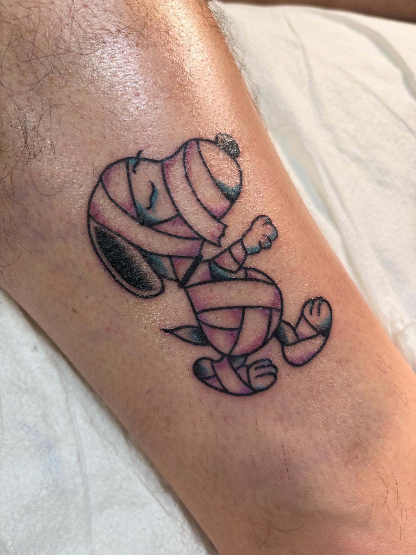 Mummy new school tattoo on the forearm by Nick Tate