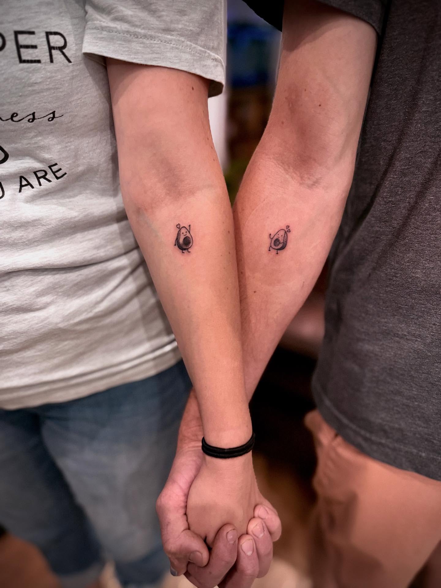 Pig and avocado minimalist tattoo on the forearm by Erick