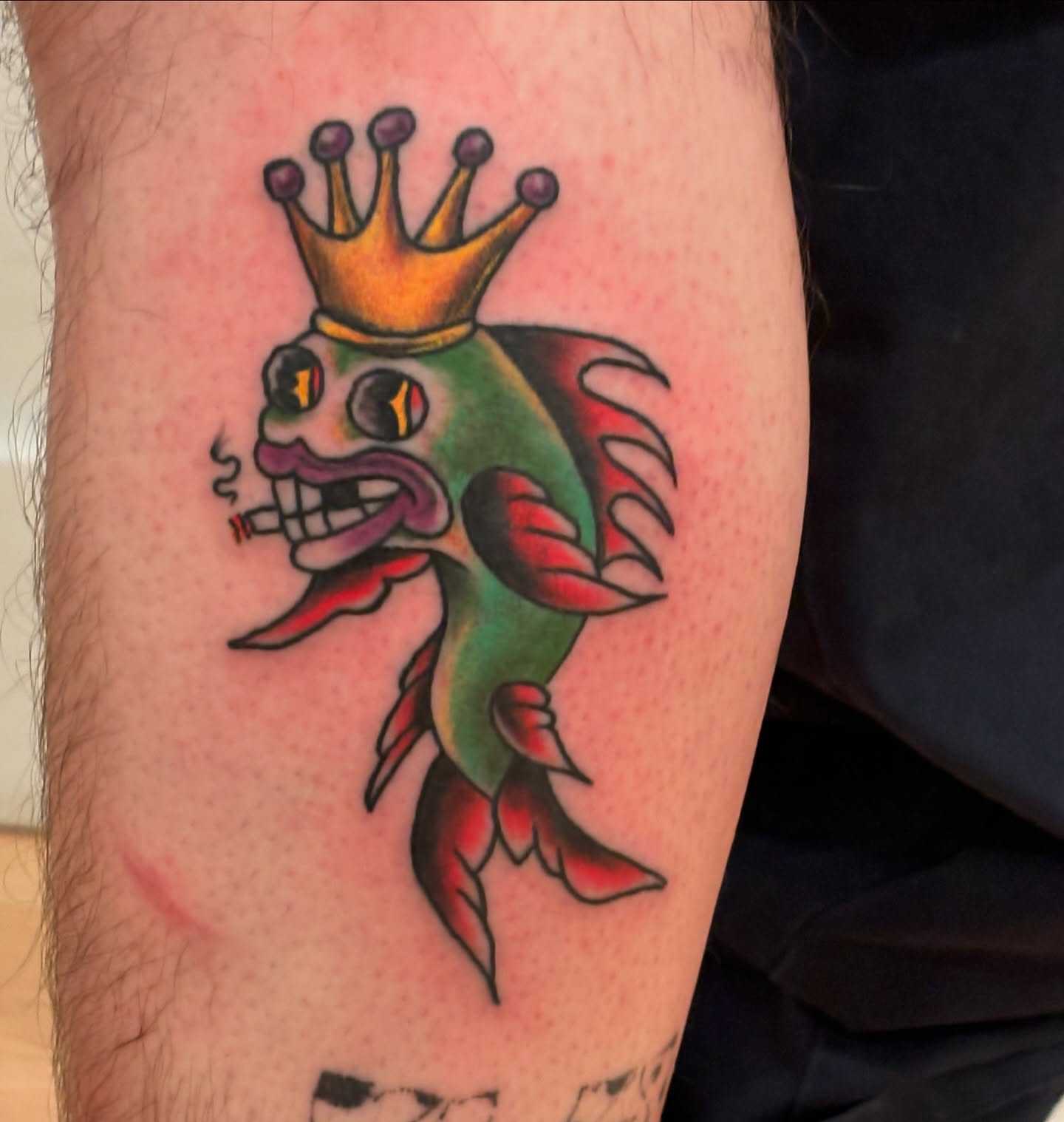 Fish with crown American traditional tattoo on the forearm by Francis Cassidy