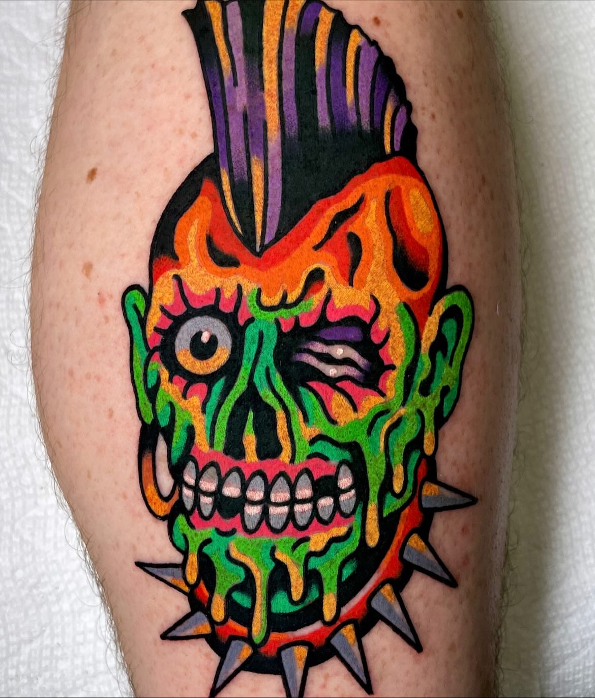 Mohawk skull American traditional tattoo on the forearm by Ryan McDonald