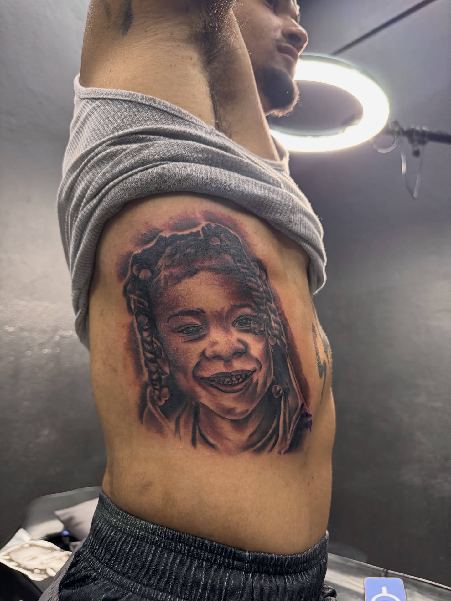 Child's face realism tattoo on the shoulder by Zeus