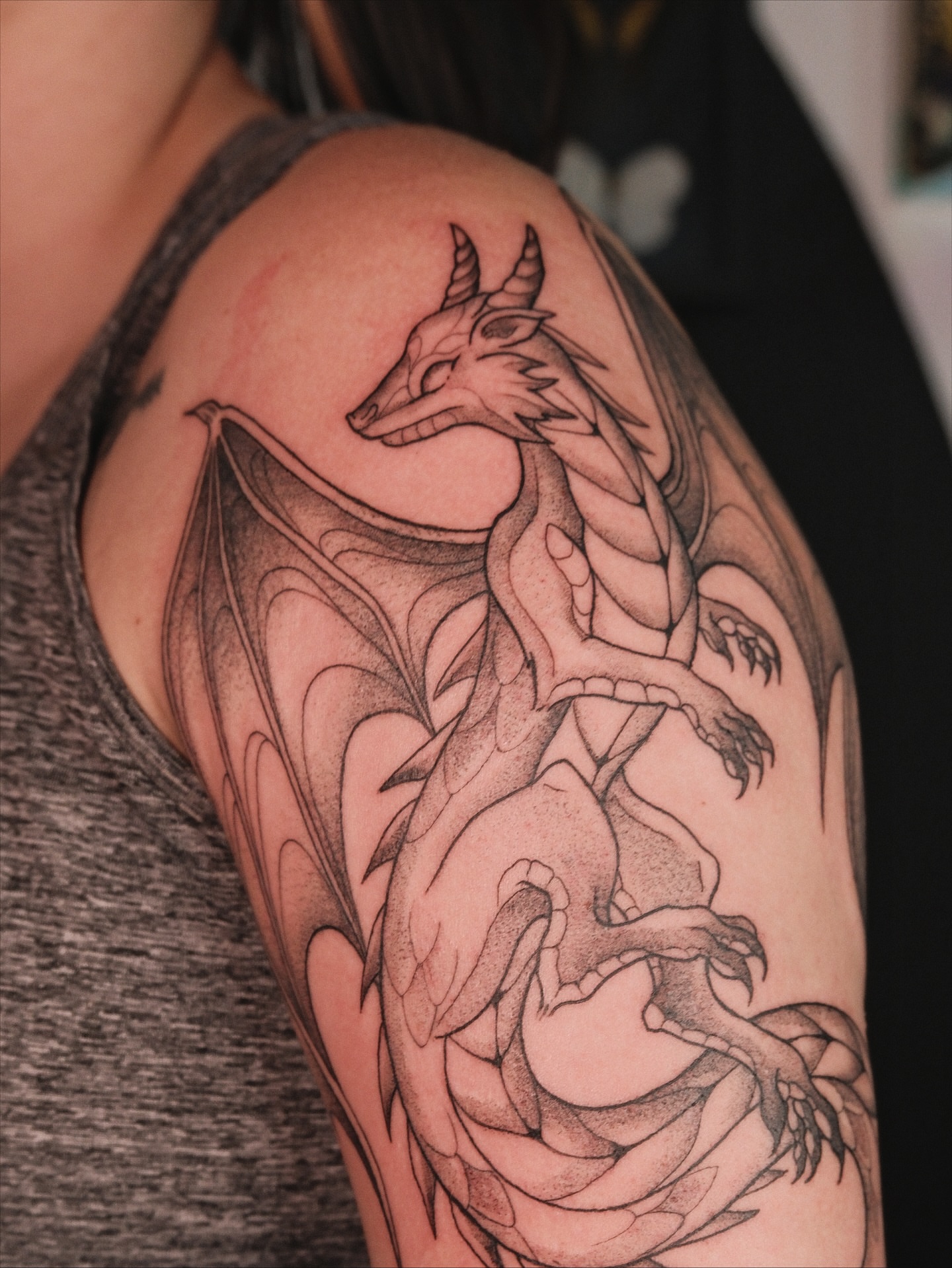 Dragon black and grey tattoo on the shoulder by Velvet, Seattle, Washington
