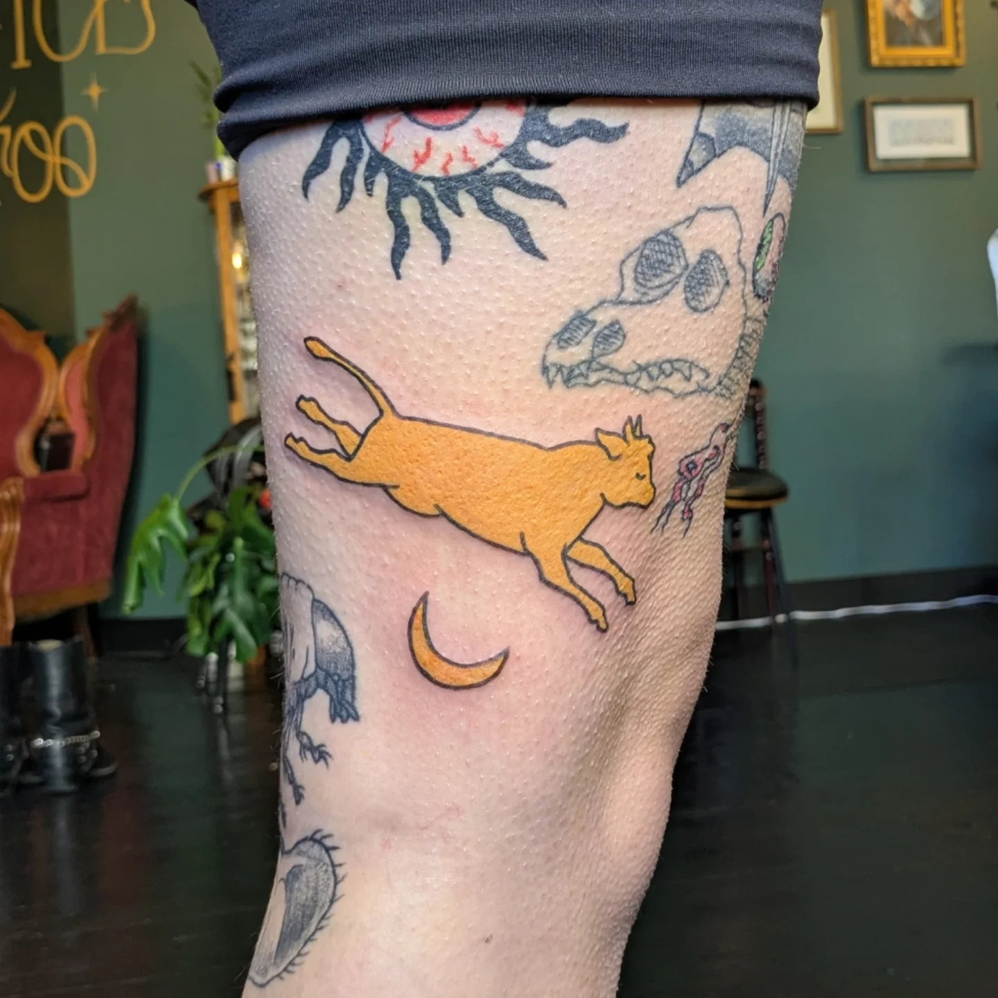 Cat chasing dragon American traditional tattoo on the leg by Madison Cañedo ✺ Portland tattoo