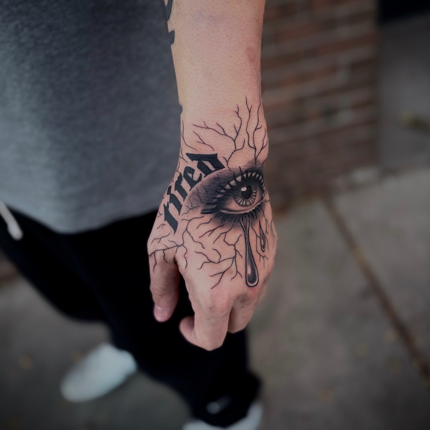 Eye with cracked skin realism tattoo on the hand by Lauren Dempsey, Dearborn, Michigan