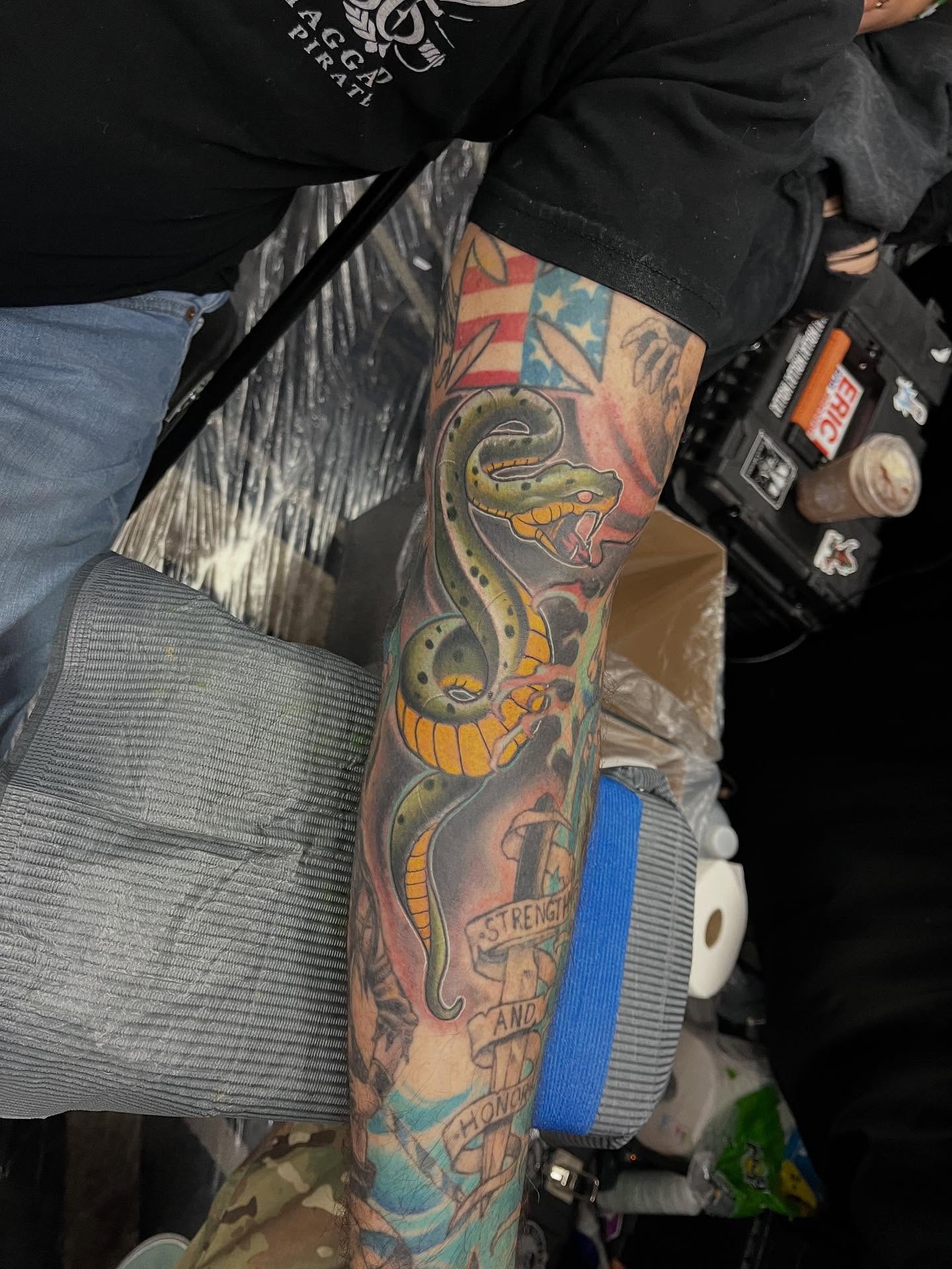 Snake American traditional tattoo on the forearm by scottyjstattoos