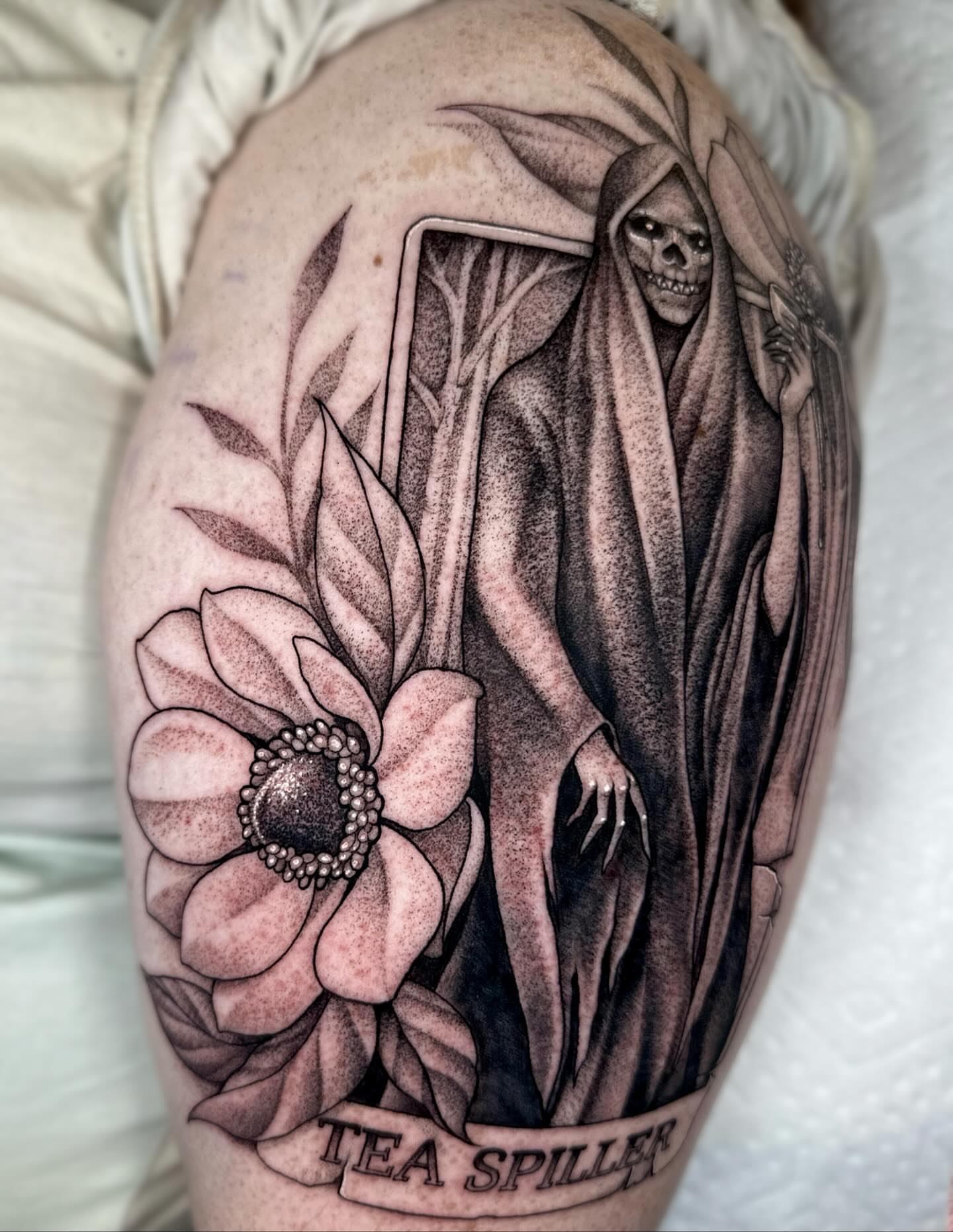 Grim reaper and flower realism tattoo on the forearm by ᴇʟɪᴢᴀ ɢᴏɴᴢᴀʟᴇᴢ