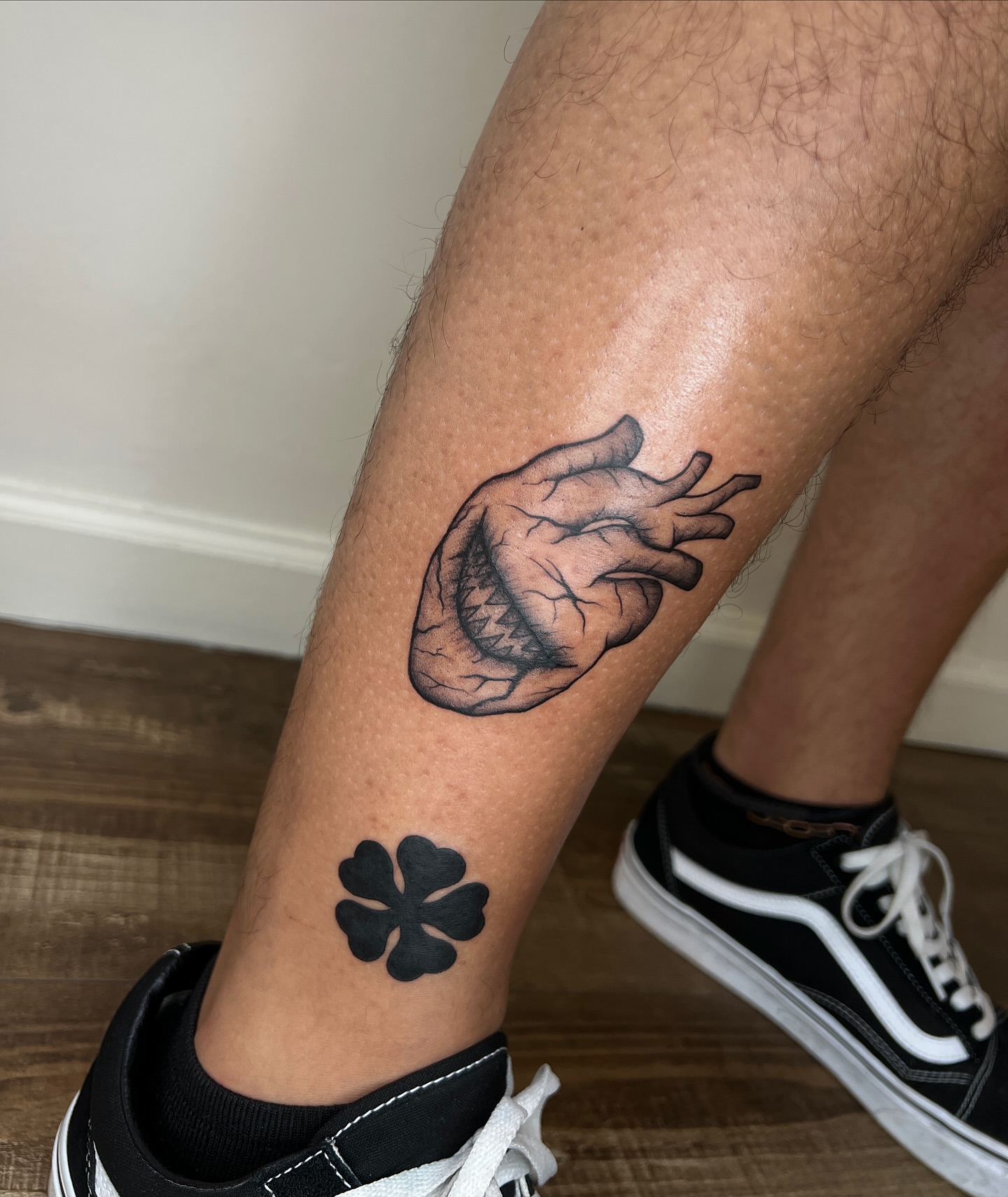 Heart and clover realism tattoo on the forearm by Diana García