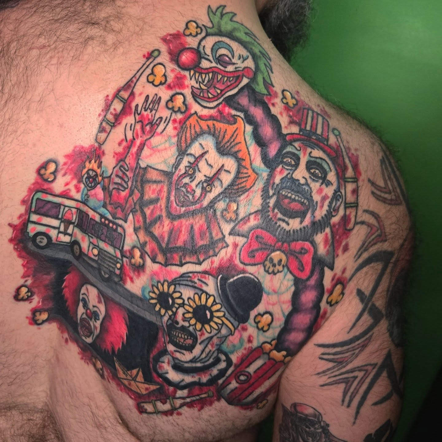 Clowns and bus trash polka tattoo on the chest by Abigail (Bgail) Boyd
