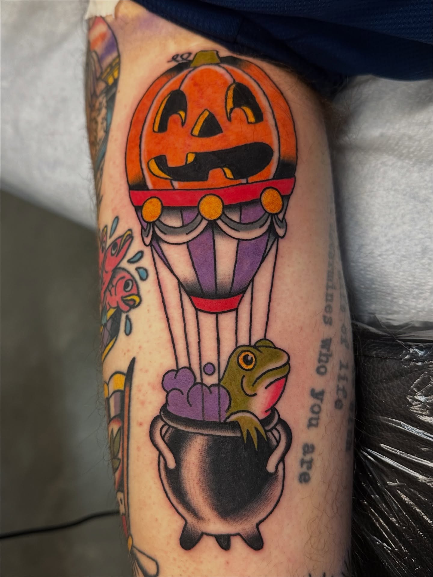 Hot air balloon with pumpkin American traditional tattoo on the forearm by Emily Masa