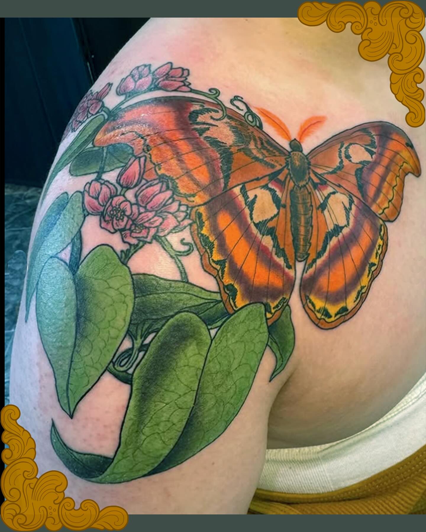 Butterfly and flowers realism tattoo on the shoulder by Patrick Carroll