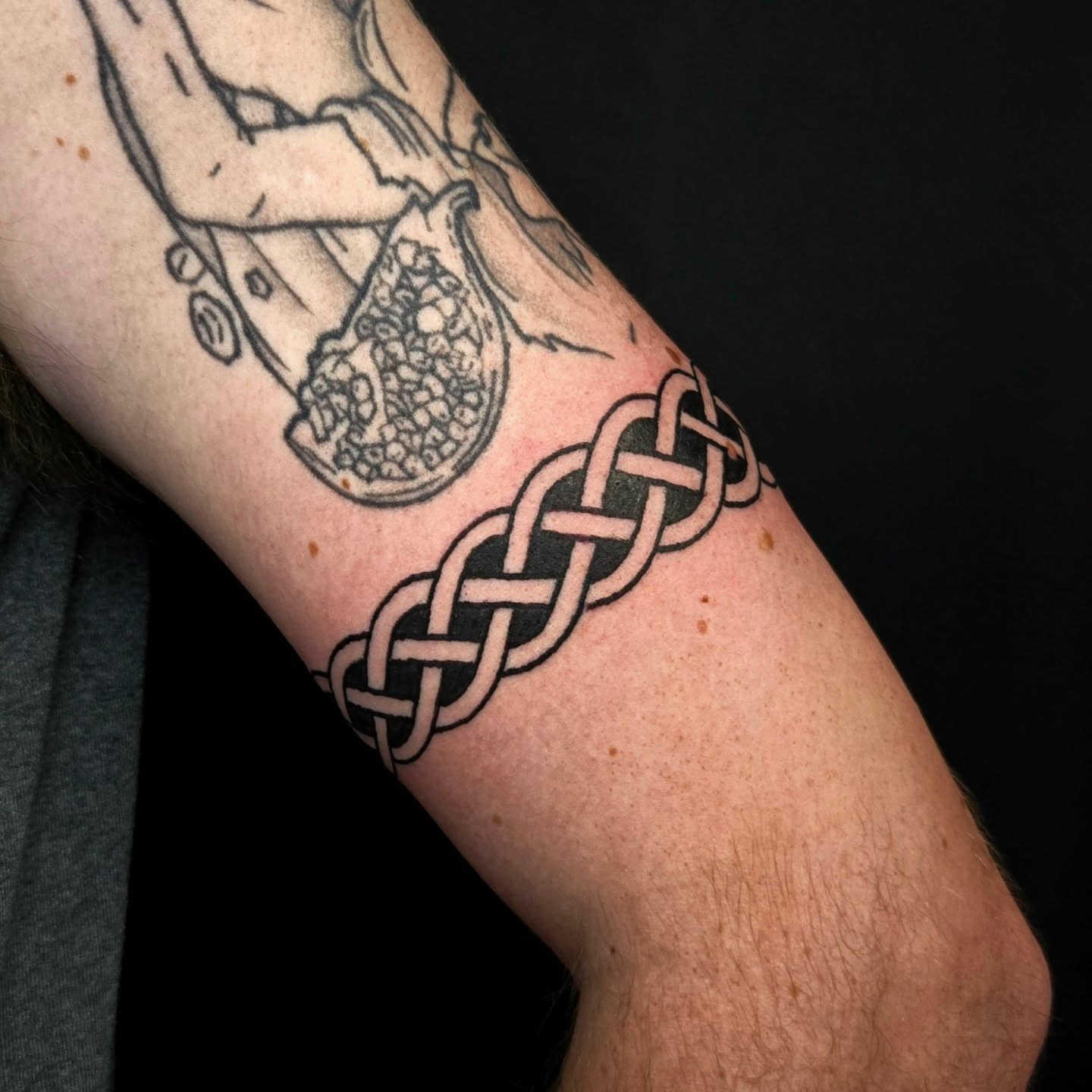 Celtic knot black and grey tattoo on the forearm by Perry