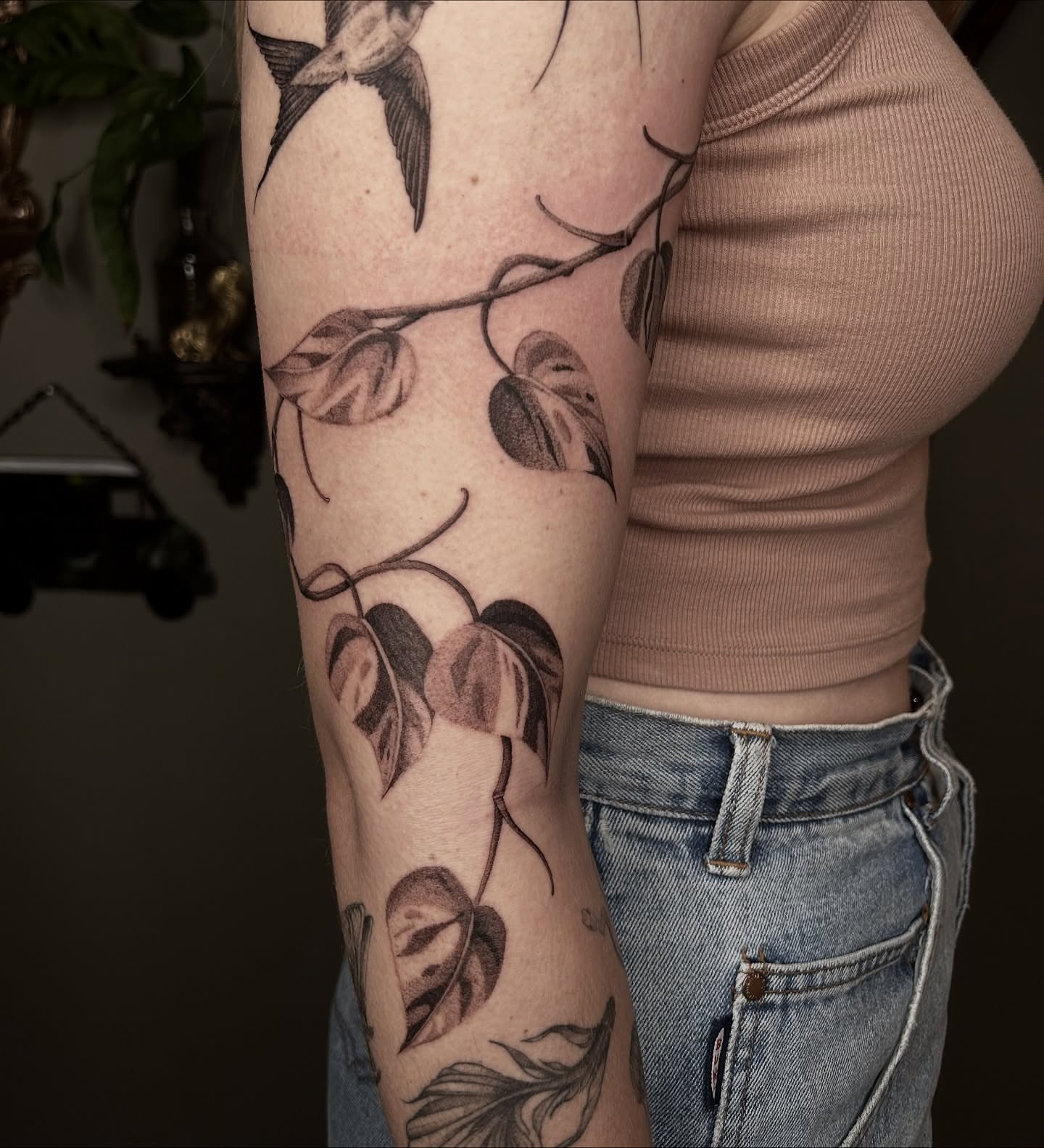 Branch with leaves black and grey tattoo on the forearm by 𝕤𝕒𝕧𝕒𝕟𝕟𝕒