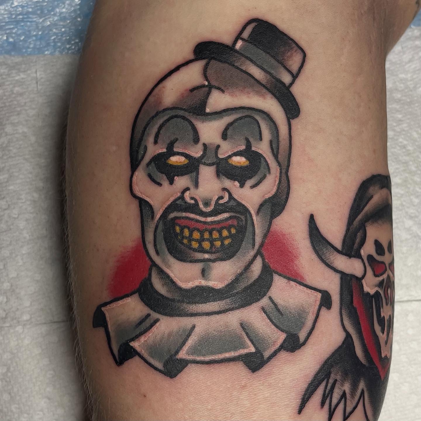 Clown American traditional tattoo on the forearm by Robert Morrow