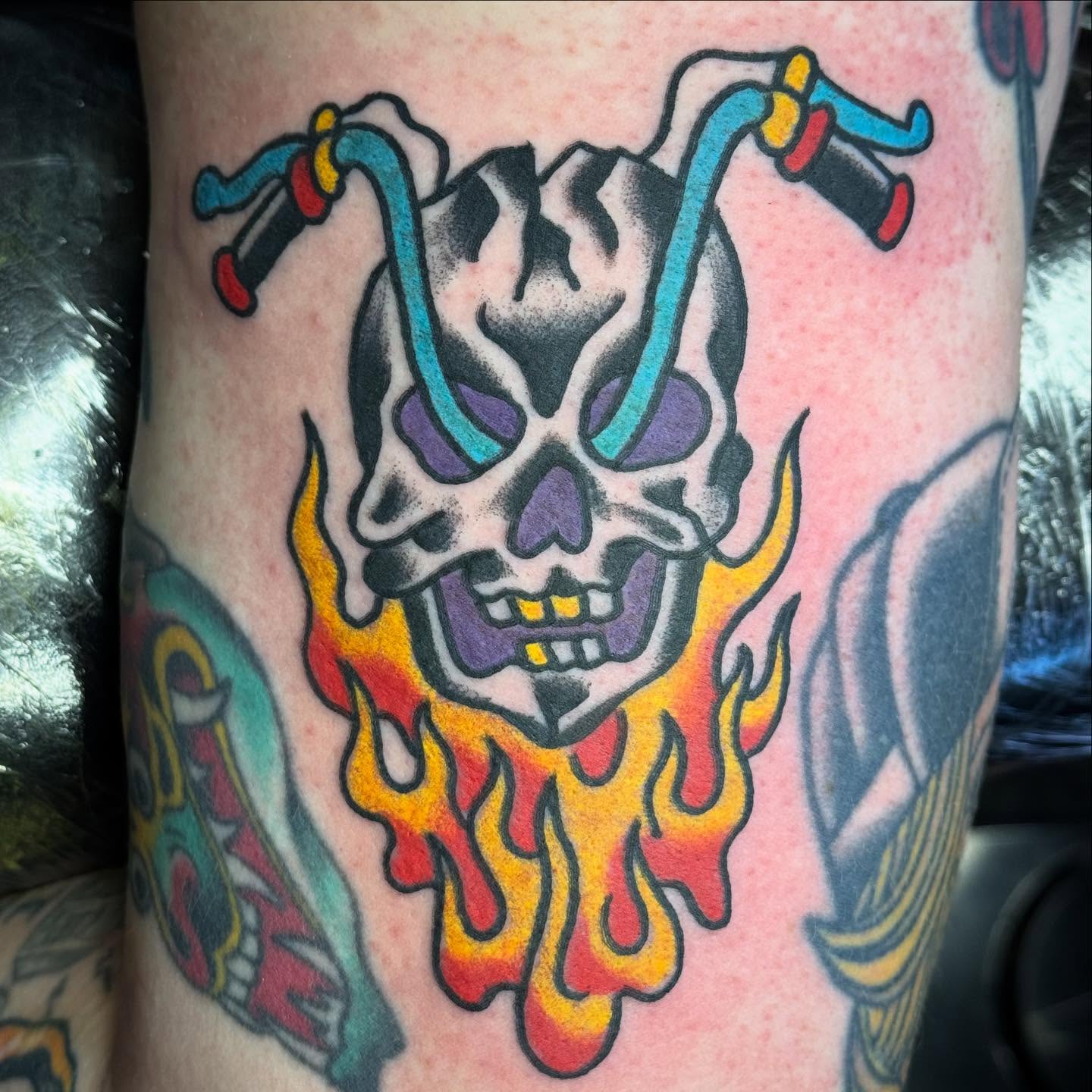 Skull with flames American traditional tattoo on the forearm by Sam Hambrick, Watchung NJ