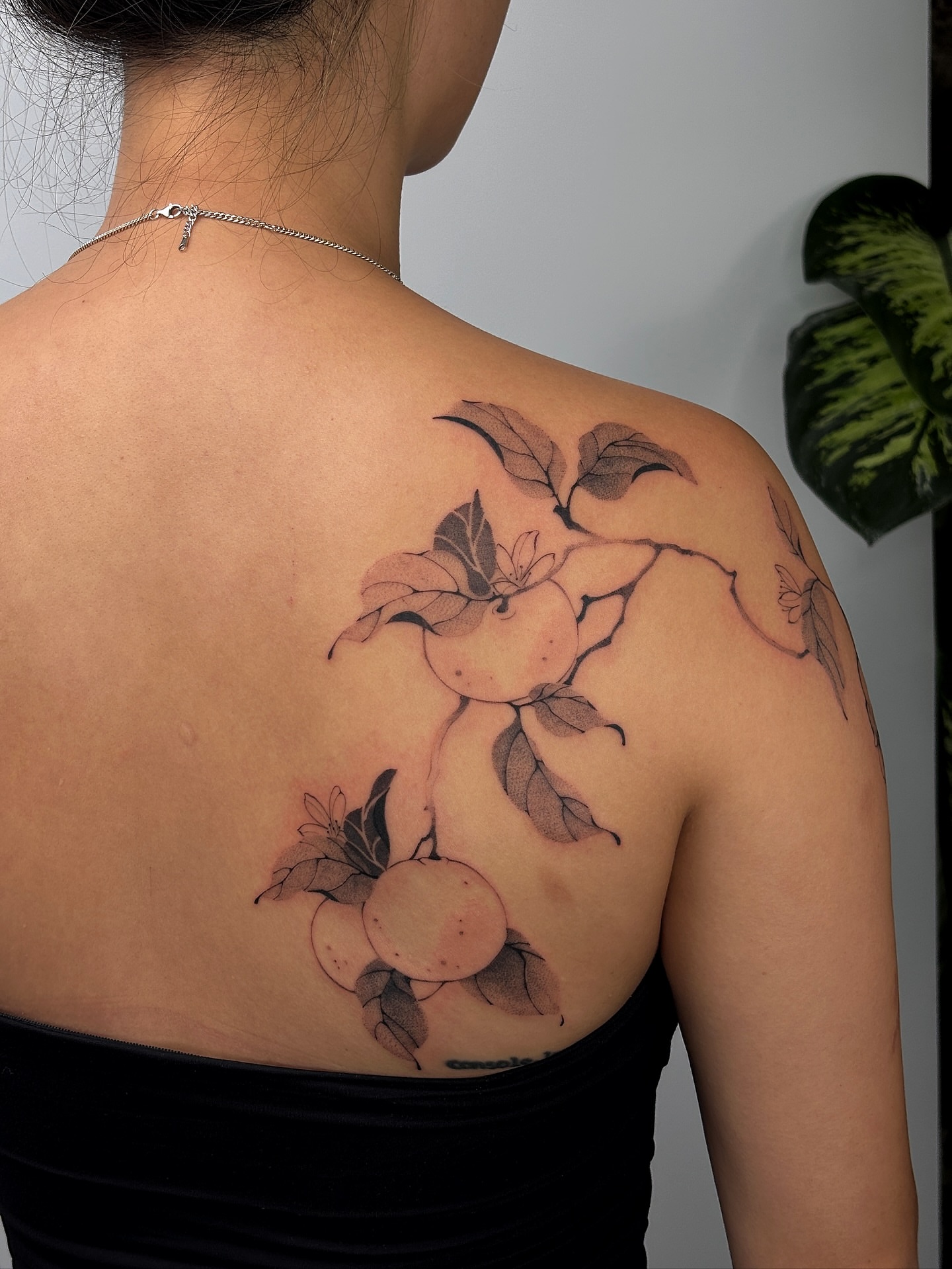 Peaches and leaves black and grey tattoo on the shoulder by sago, Berkeley, California