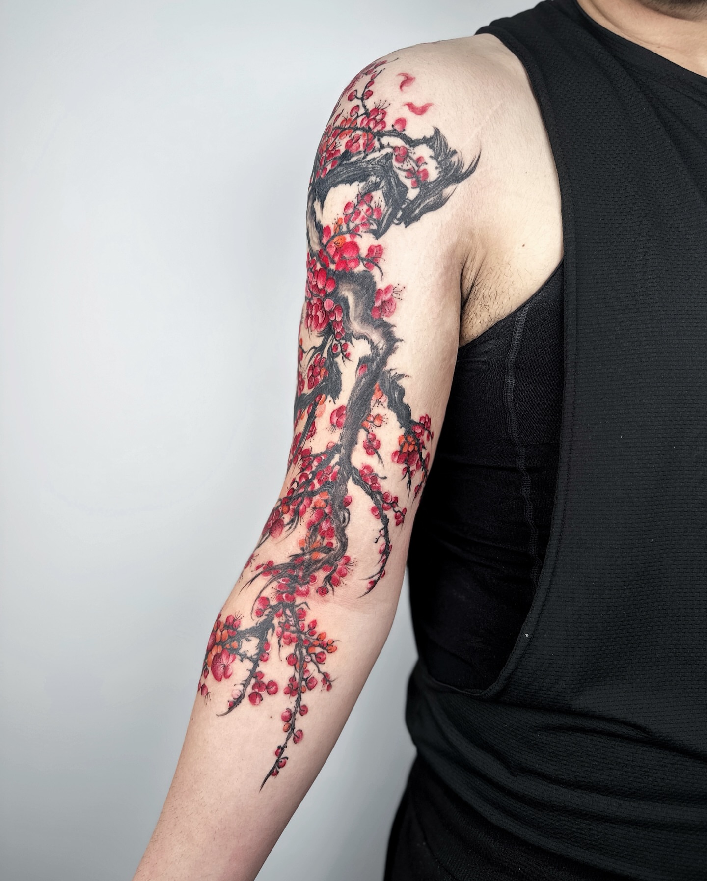 Cherry blossom tree dotwork tattoo on the upper arm by Jiang_Tattooer