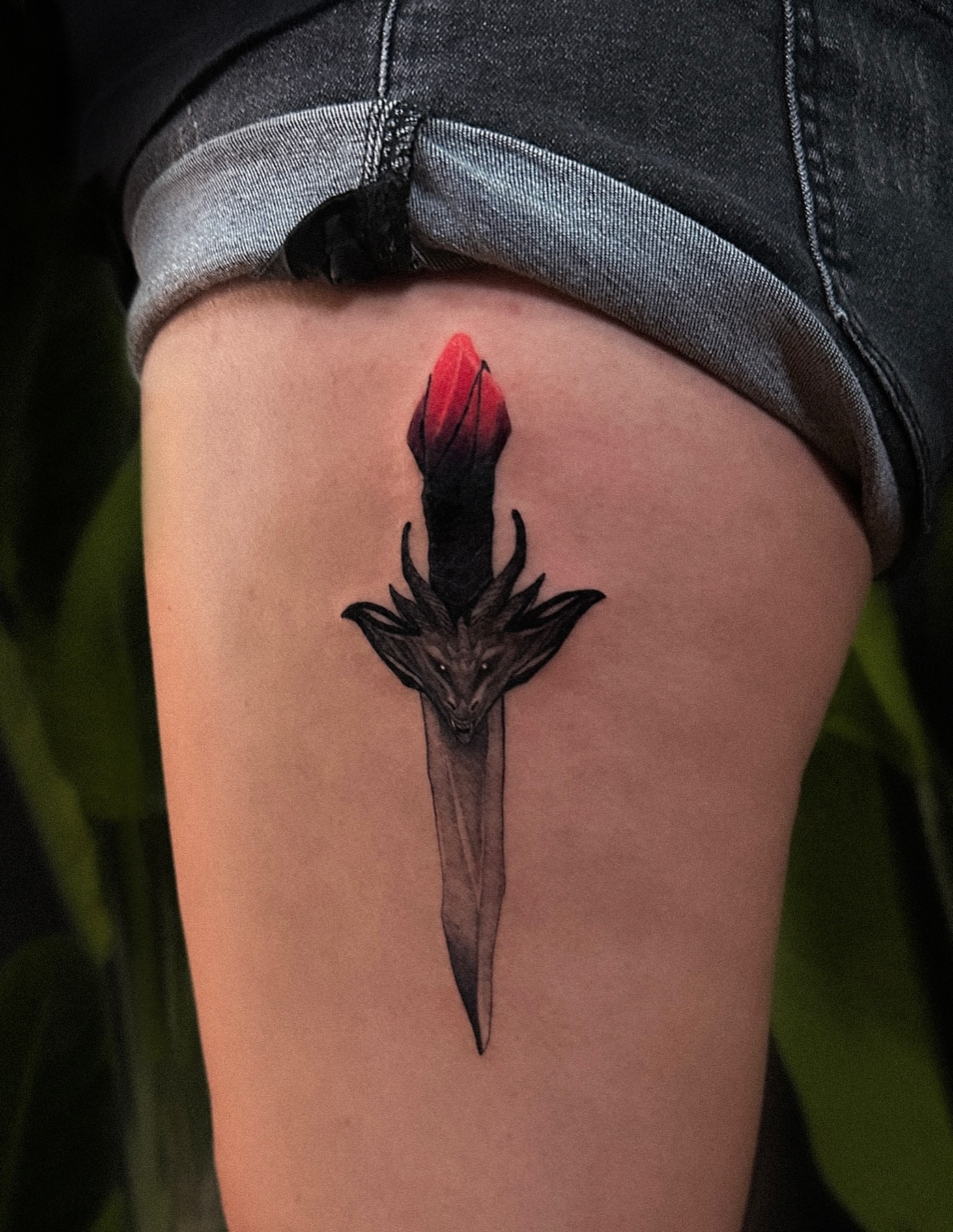 Sword with dragon head dark realism tattoo on the thigh by Tattoo Artist 👩🏻‍🎨 ATX