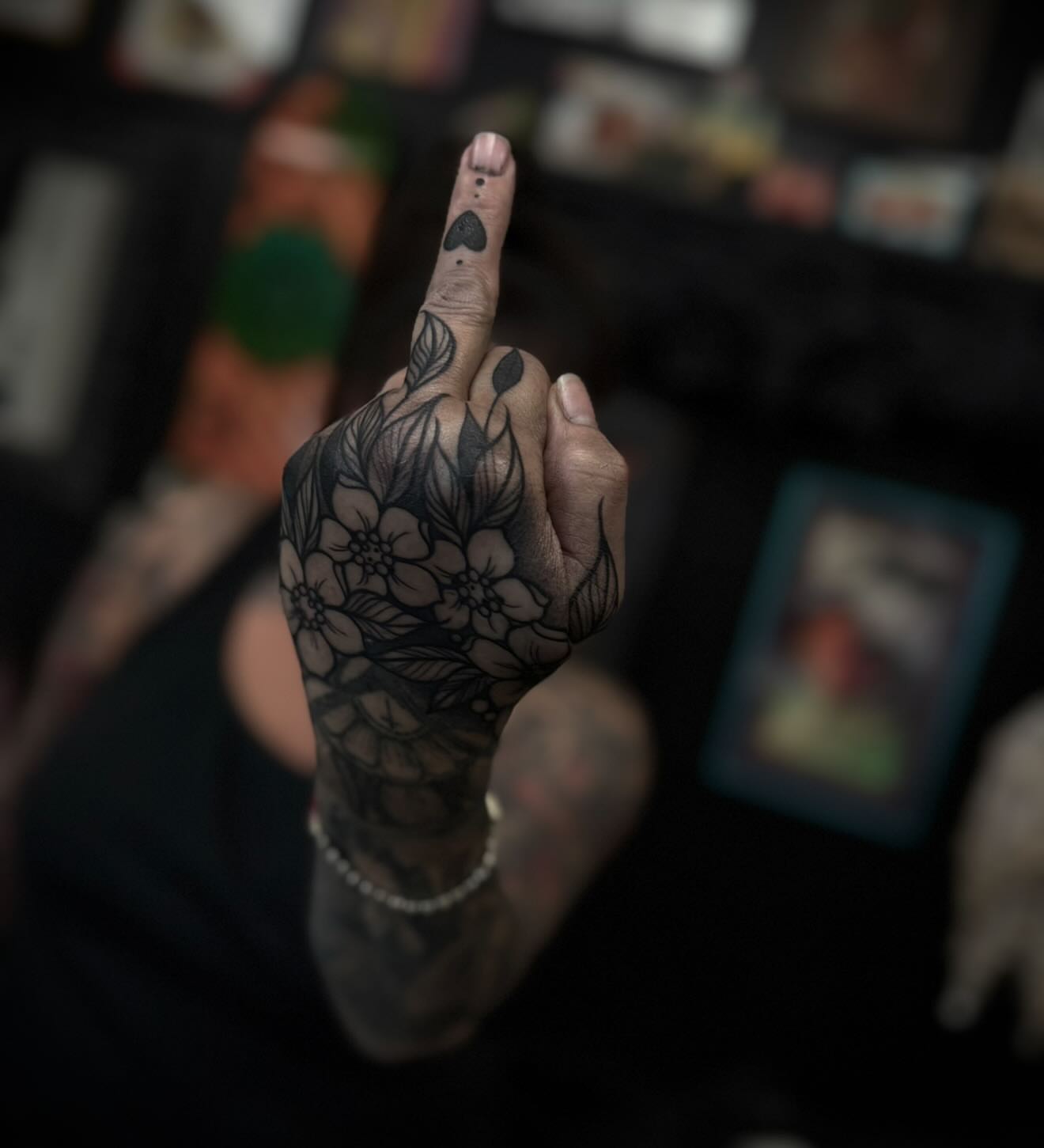 Floral design black and grey tattoo on the hand by M A R I B e T H▪️k L A A R