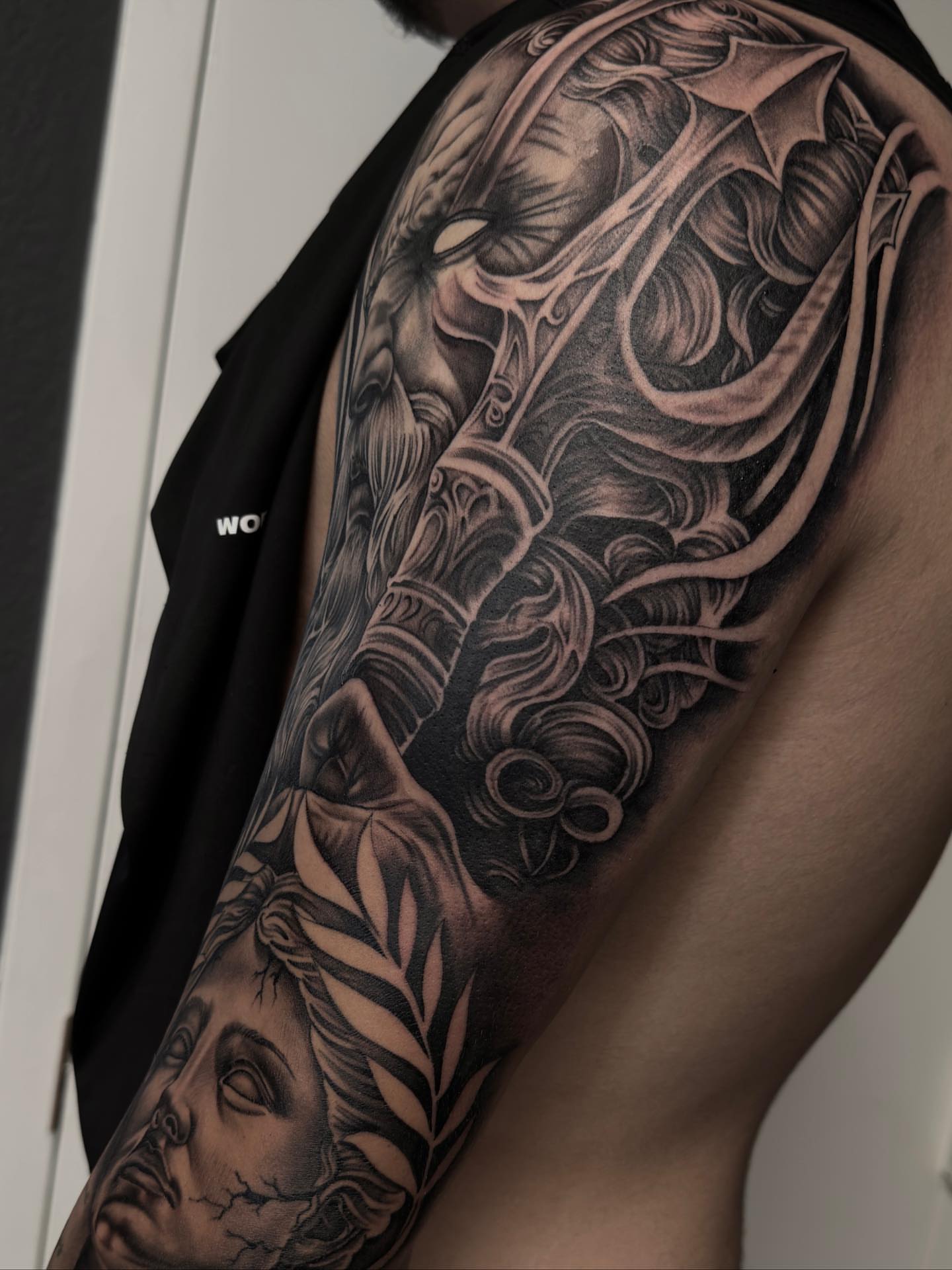 Woman's head with roses realism tattoo on the forearm by Hugo Ruiz-Esparza