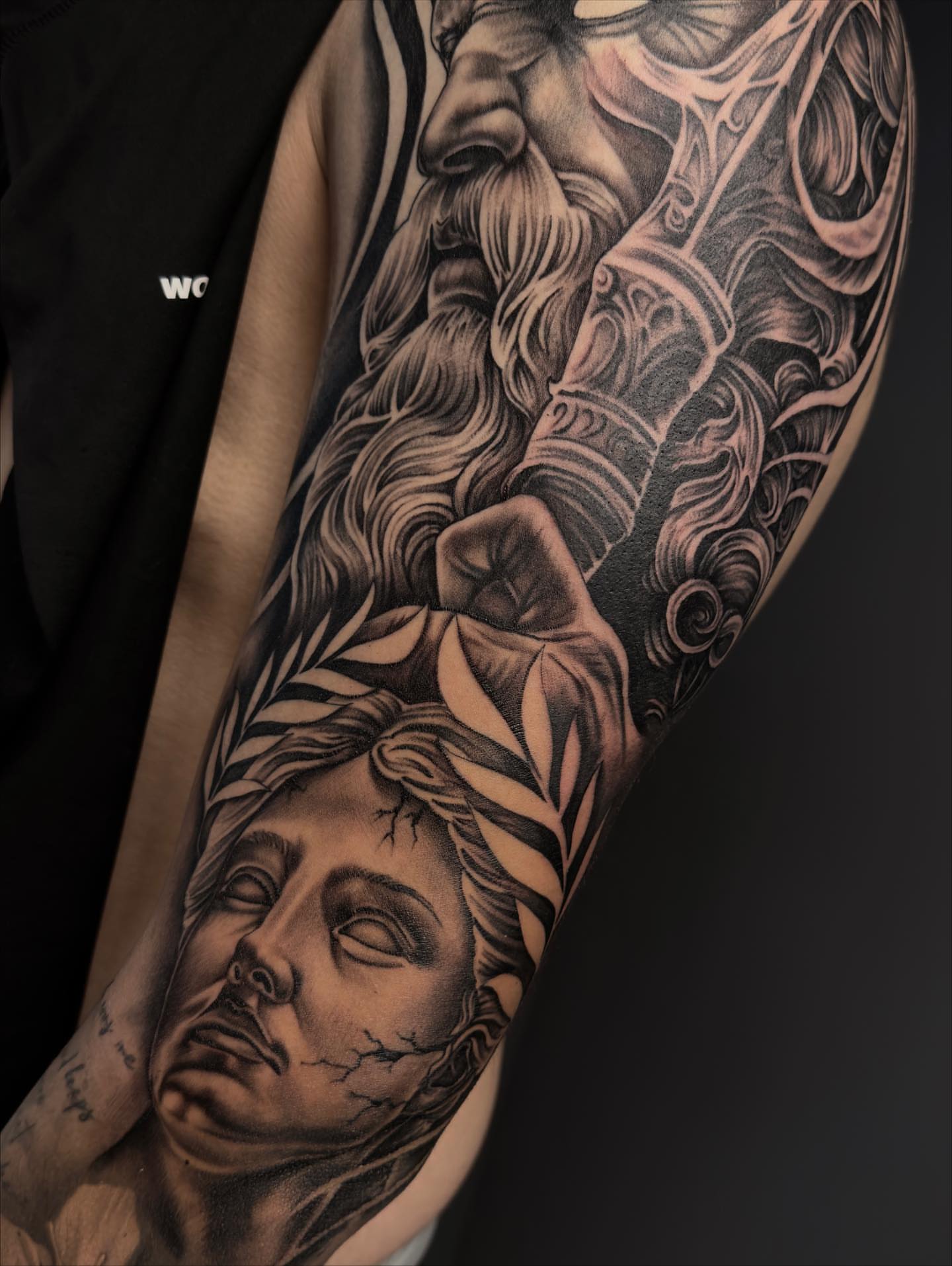 God and woman realism tattoo on the forearm by Hugo Ruiz-Esparza
