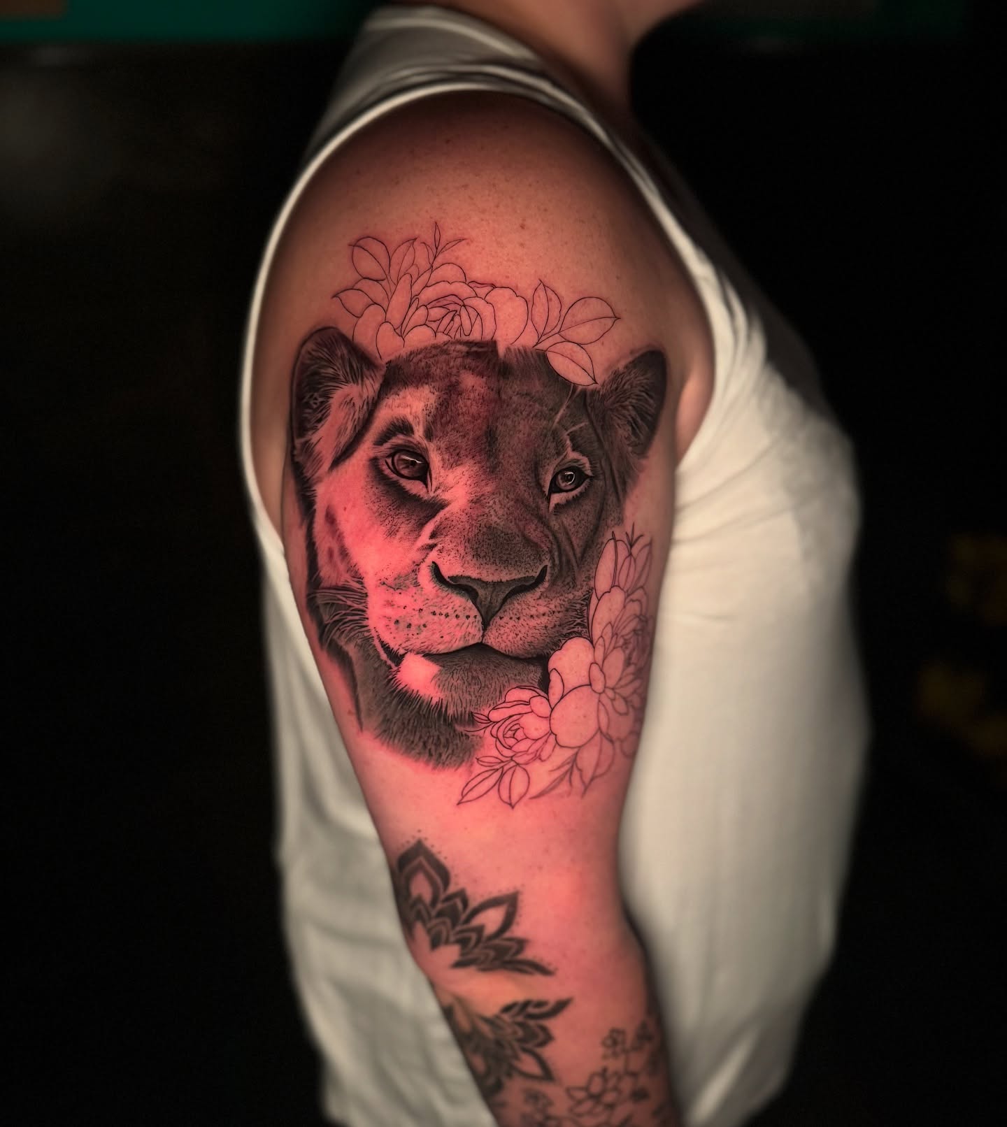 Lion with flowers realism tattoo on the shoulder by Tay 🥀