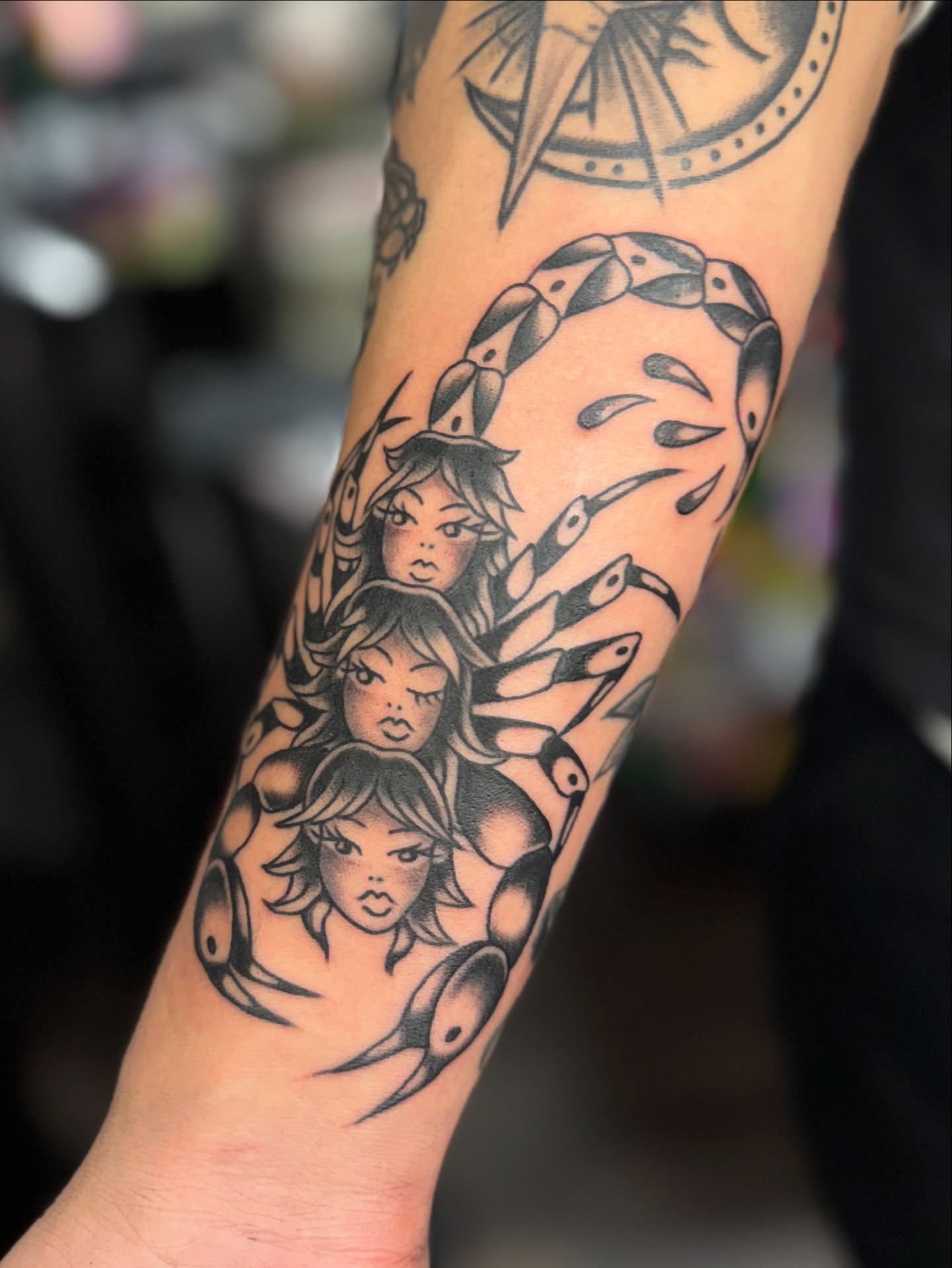 Three-headed woman American traditional tattoo on the forearm by Sarah Pham