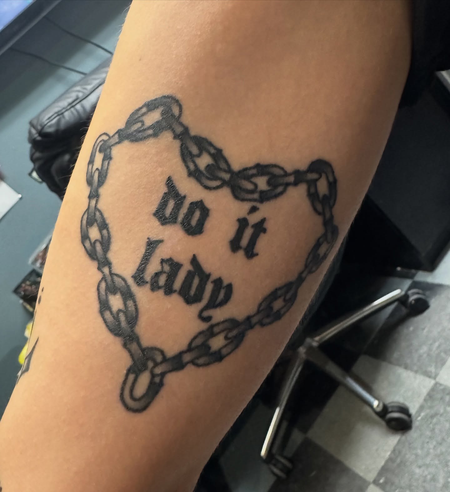 Chain with text black and grey tattoo on the forearm by Michael Roehrich (MEECH!)