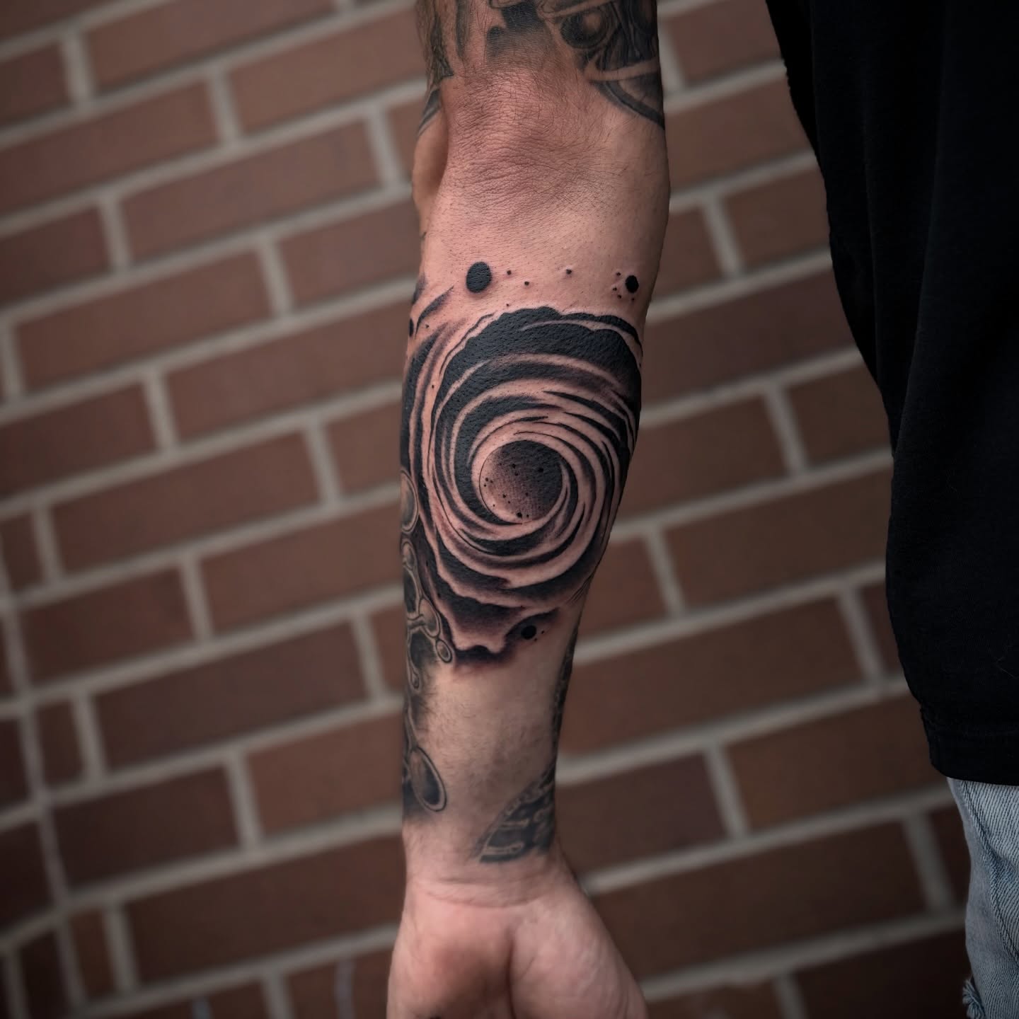 Swirl dotwork tattoo on the forearm by Lauren Dempsey, Dearborn, Michigan