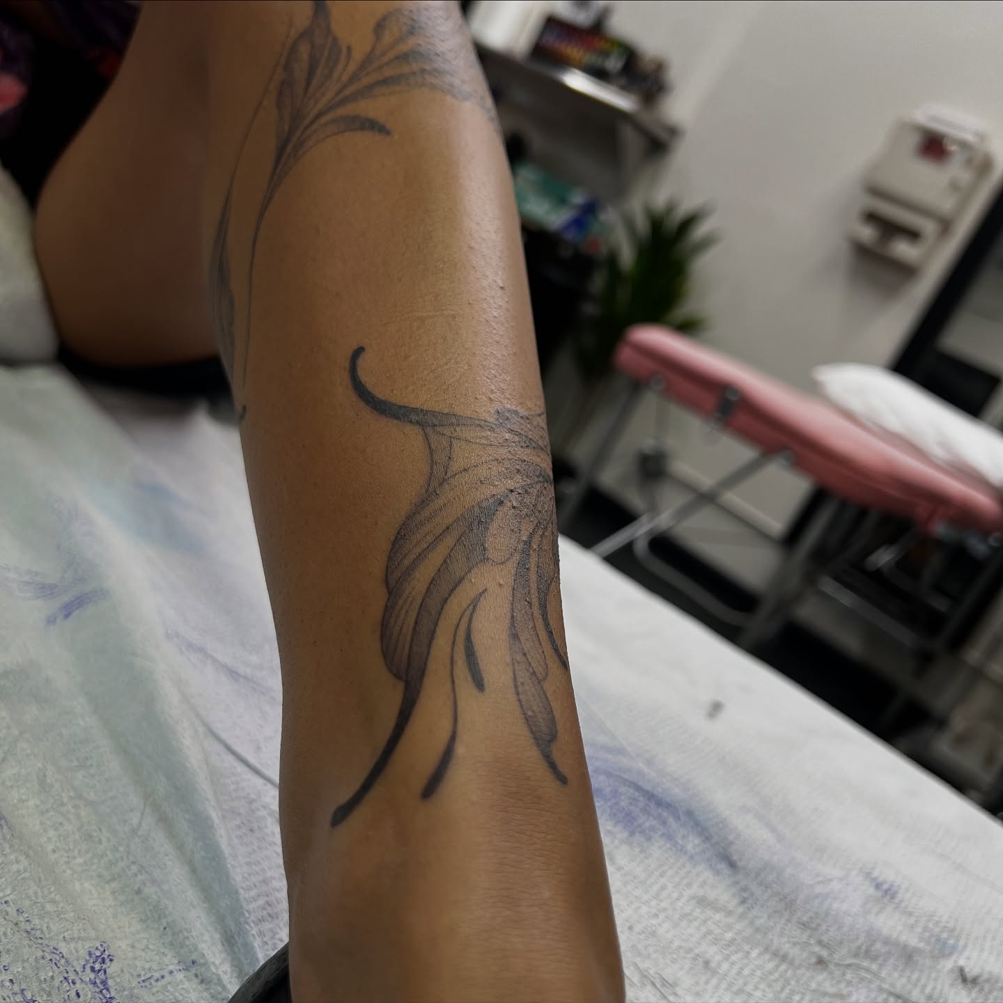 Feather black and grey tattoo on the forearm by Daphne Landry