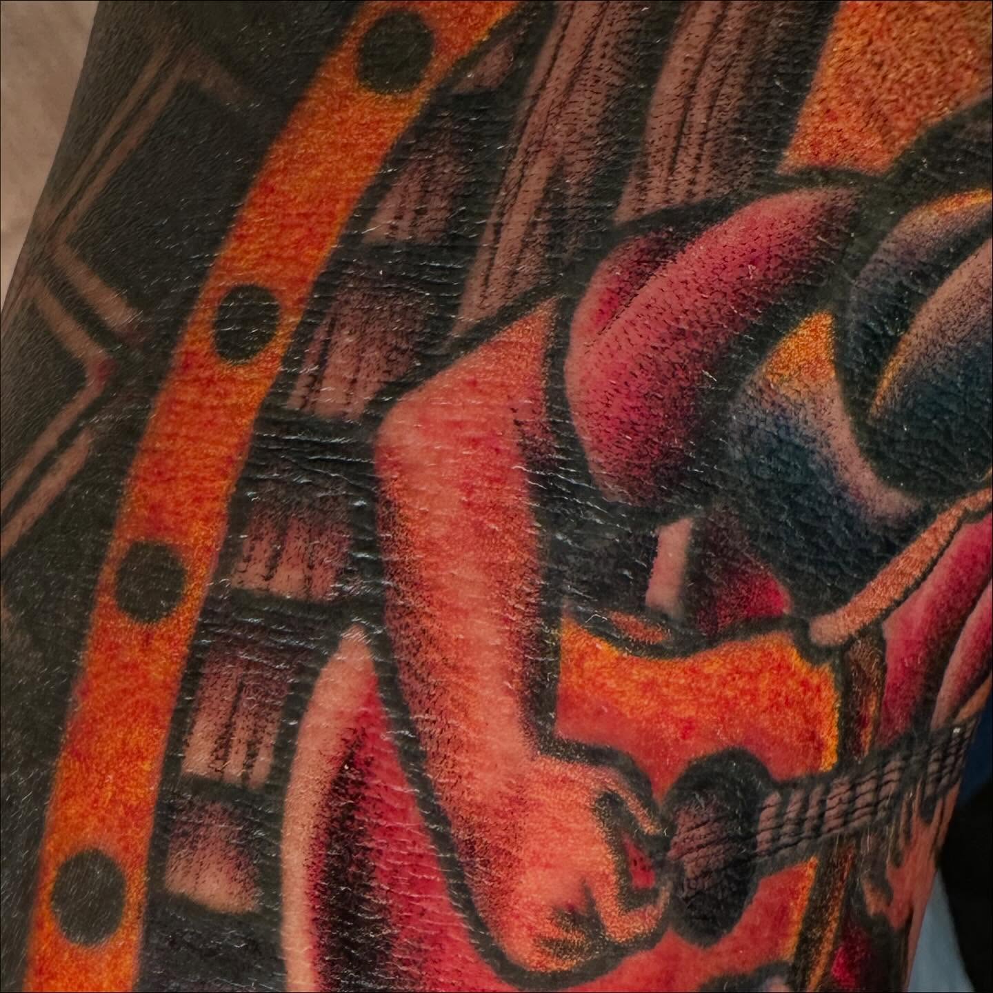Skull and guitar American traditional tattoo on the forearm by Jenni Hand - Tattoo, Maryville, Tennessee