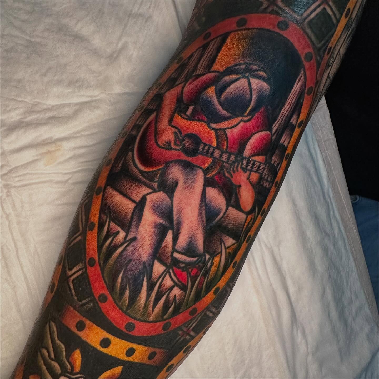 Astronaut playing guitar American traditional tattoo on the forearm by Jenni Hand - Tattoo, Maryville, Tennessee