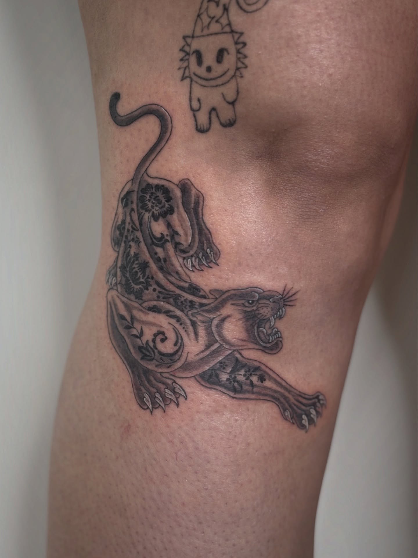 Panther black and grey tattoo on the forearm by @tattotos
