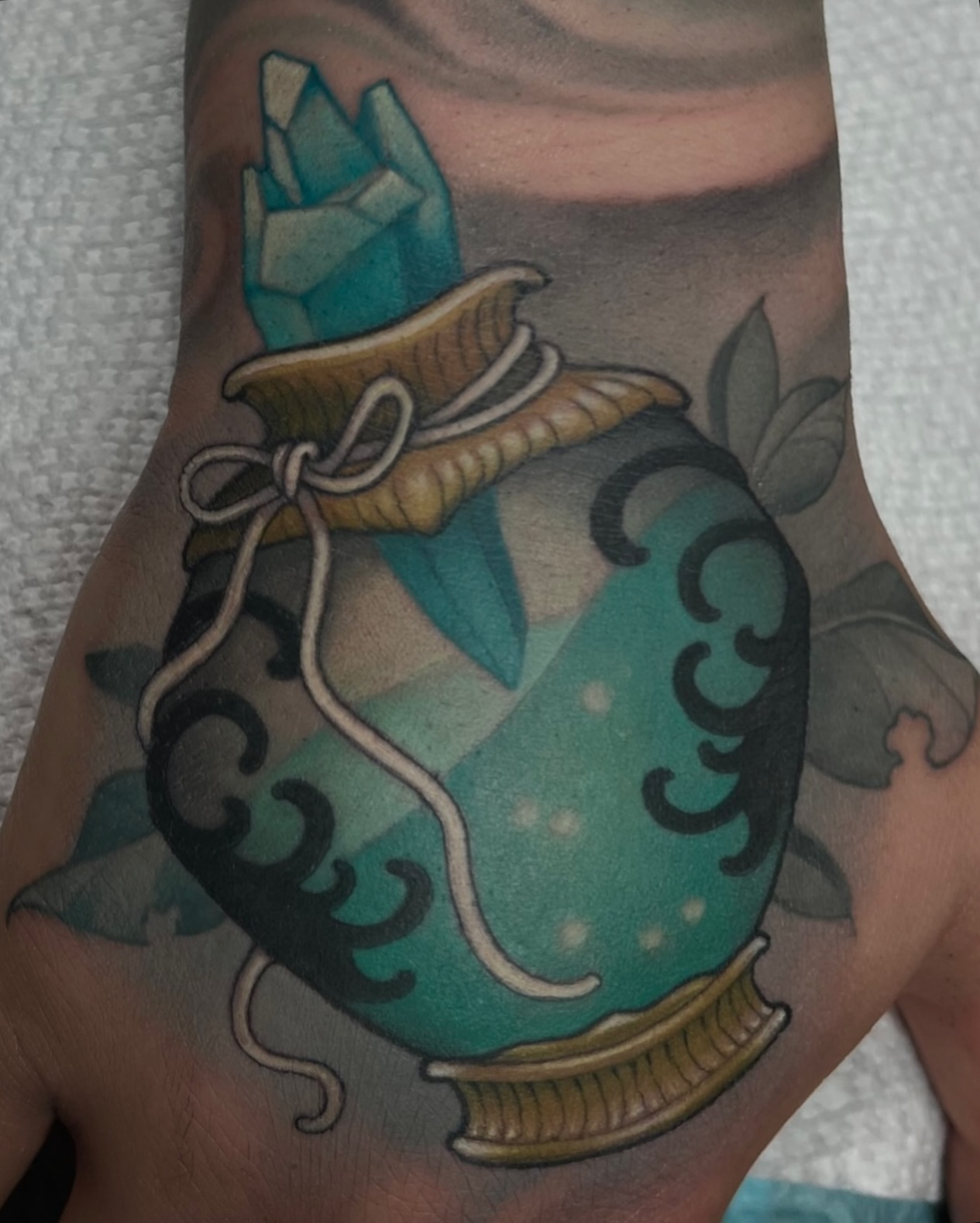 Vase with crystal American traditional tattoo on the forearm by Madison Ast Tattoo