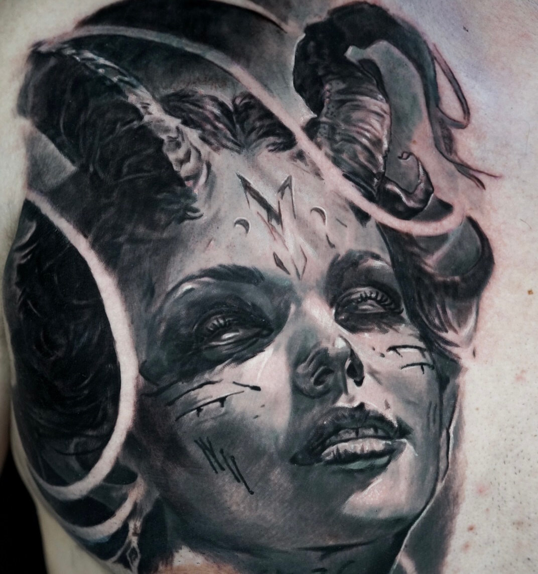 Woman with horns dark realism tattoo on the shoulder by Jose Carlos