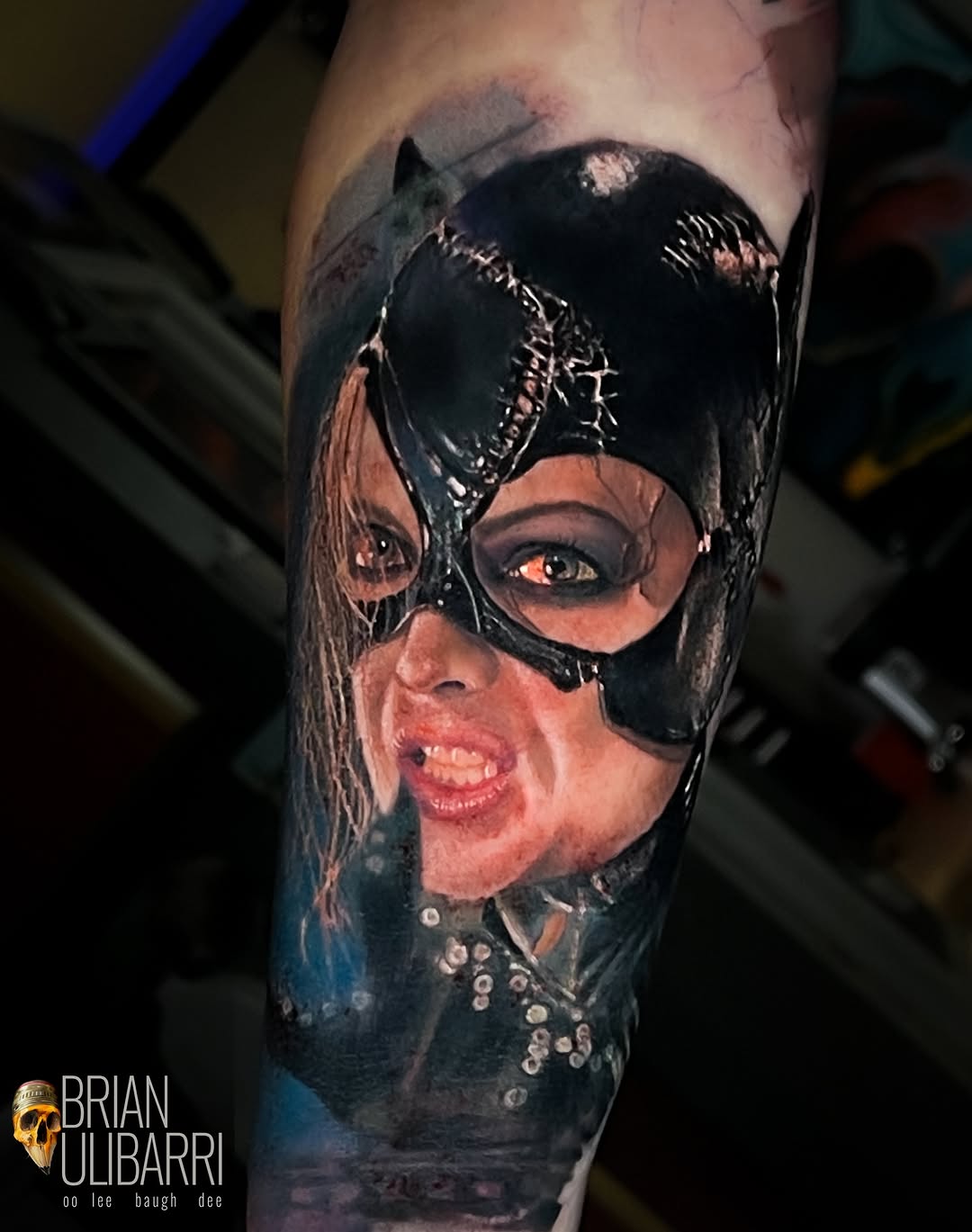 Catwoman portrait surrealism tattoo on the forearm by Brian Ulibarri