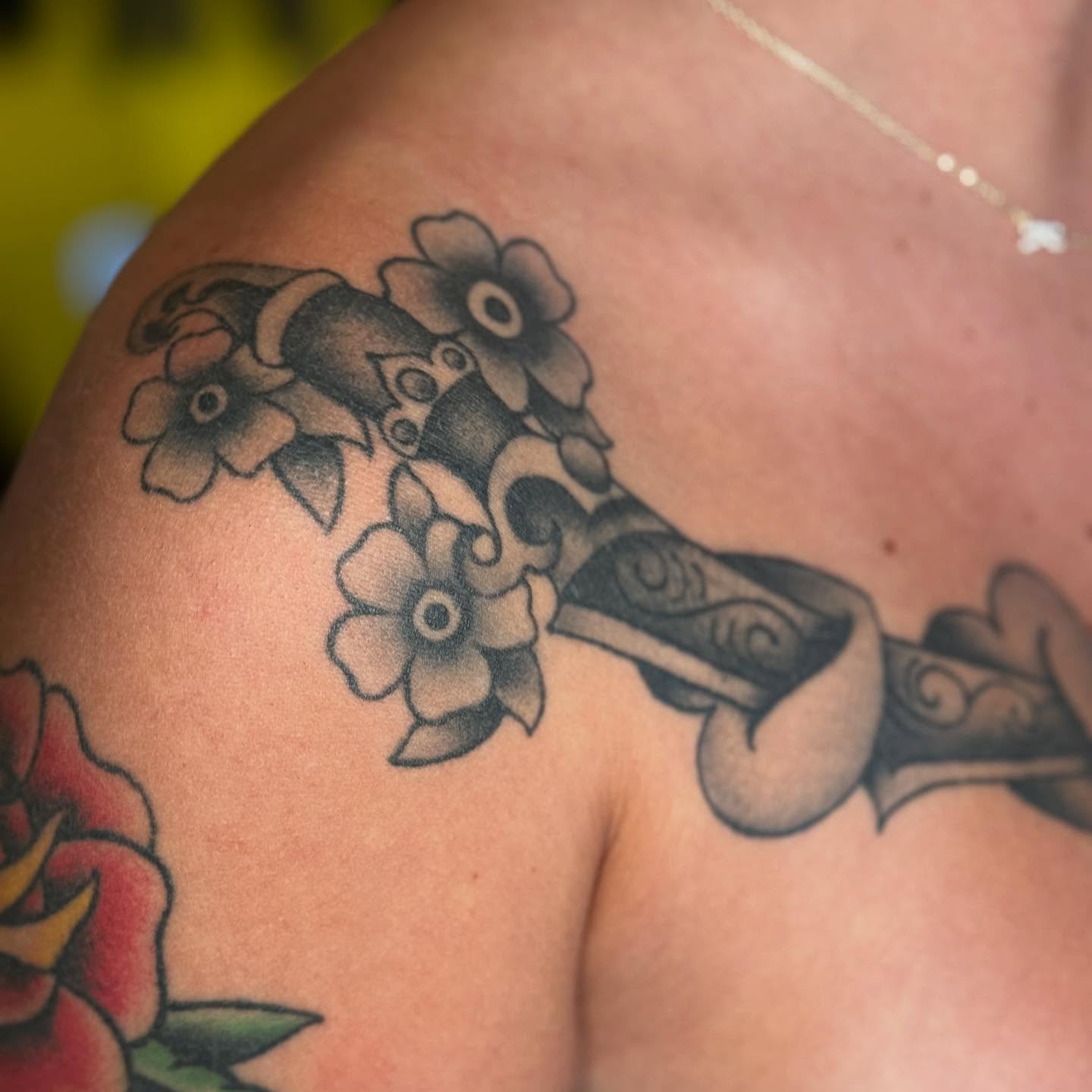 Flower bouquet black and grey tattoo on the shoulder by chloe jeanel estrada